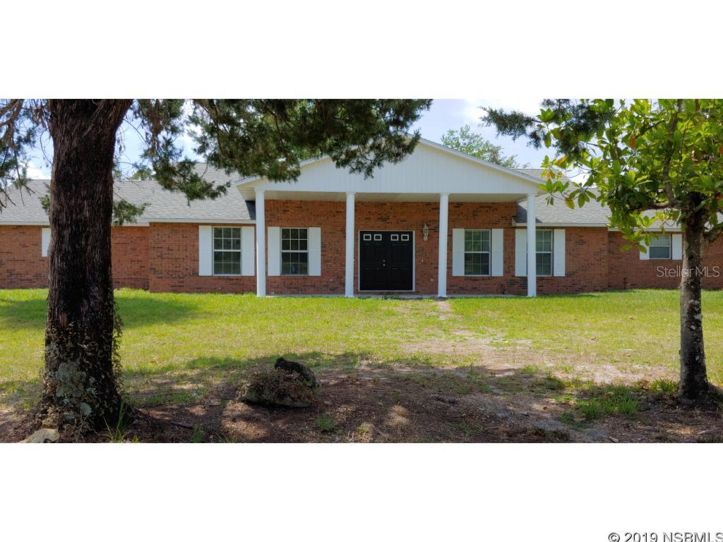 Left side of this bright and well maintained duplex. 2 Bedrooms, 2 Baths, Vinyl wood flooring throughout. Water osmosis system, Florida Room. Attached carport with room for 2 vehicles. Freshly painted and ready for move-in Located on quiet dead end street with trees and plenty of open spaces.