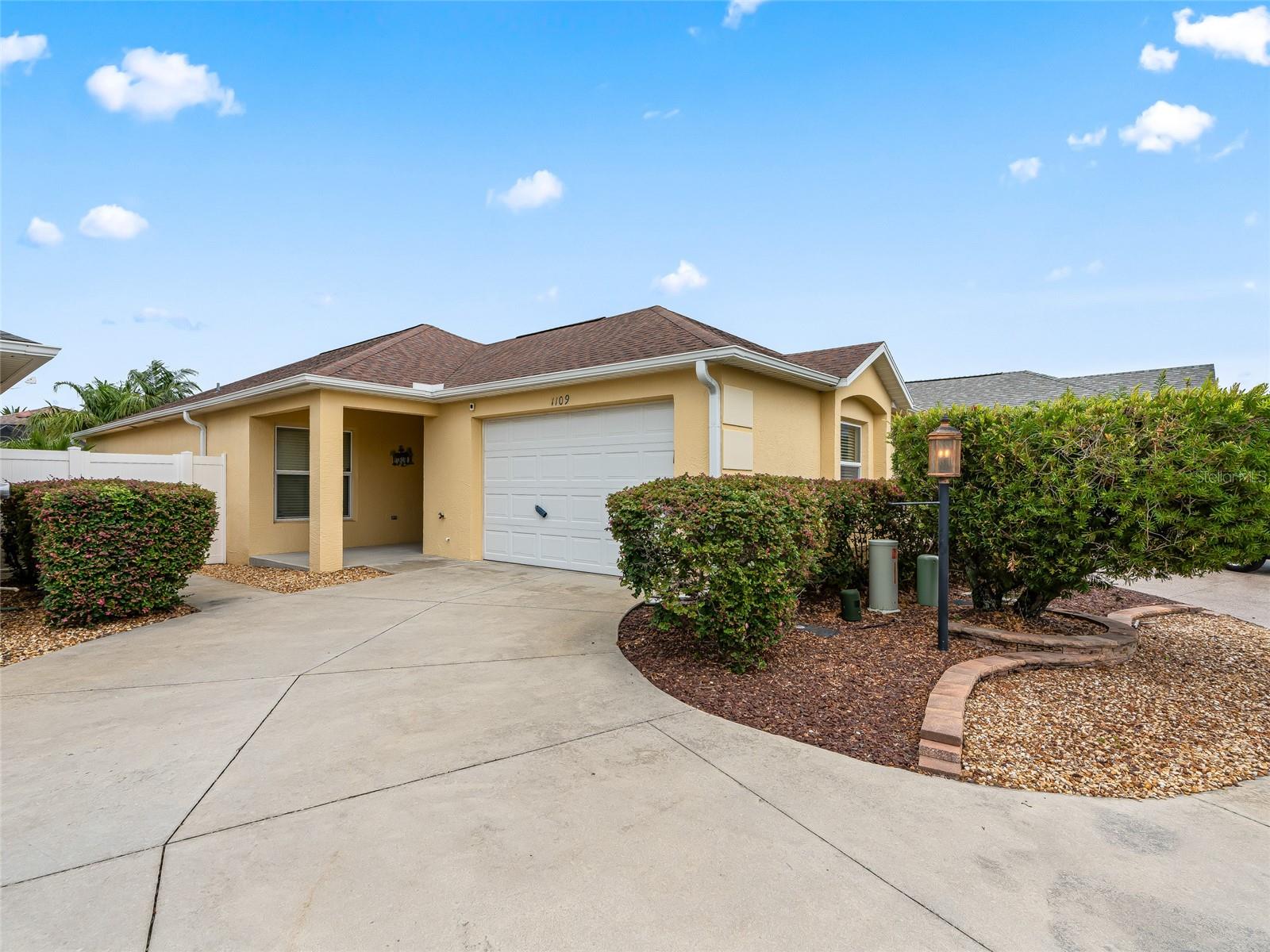 Welcome to this beautifully maintained 2-bedroom, 2-bath Courtyard Villa in the
highly desirable Village of Fernandina in The Villages, Florida. Ideally located
near Brownwood Paddock Square, this home offers the perfect blend of location,
lifestyle, and low-maintenance living with convenient golf-cart access to shopping,
dining, recreation, golf, and nightly entertainment.
Offered FULLY FURNISHED and due to the seller being out-of-state, is being sold AS-IS, this move-in-ready villa is
perfect as a full-time residence, seasonal retreat, or investment opportunity.
Inside, the home features brand new carpeting in the bedrooms and living areas,
with ceramic tile flooring in the kitchen and bathrooms. Vaulted ceilings
throughout the main living spaces create an open, airy atmosphere, while the
spacious primary bedroom is enhanced by an elegant tray ceiling.
The kitchen offers white Whirlpool appliances, abundant cabinetry, and a separate
pantry closet for additional storage. The Whirlpool washer and dryer are
conveniently located in the garage.
All windows are fitted with blinds, and the bedrooms feature soft sheer curtains for
added warmth and privacy. The screened lanai provides a comfortable outdoor
living space and includes a pull-down shade to help shield from the afternoon sun.
Just outside the lanai, an additional concrete patio creates the perfect spot for
grilling and outdoor relaxation.
The exterior features durable block stucco construction, mature shrubs, and
attractive rock landscaping designed for ultra low-maintenance living and year-
round curb appeal.
Located in one of the most sought-after areas of The Villages, Fernandina is known
for its ideal balance of convenience, recreation, and established neighborhood
charm. Residents enjoy close proximity to pools, recreation centers, executive golf
courses, country clubs, pickleball, walking paths, and all the amenities that make
The Villages one of Florida’s premier active adult communities.