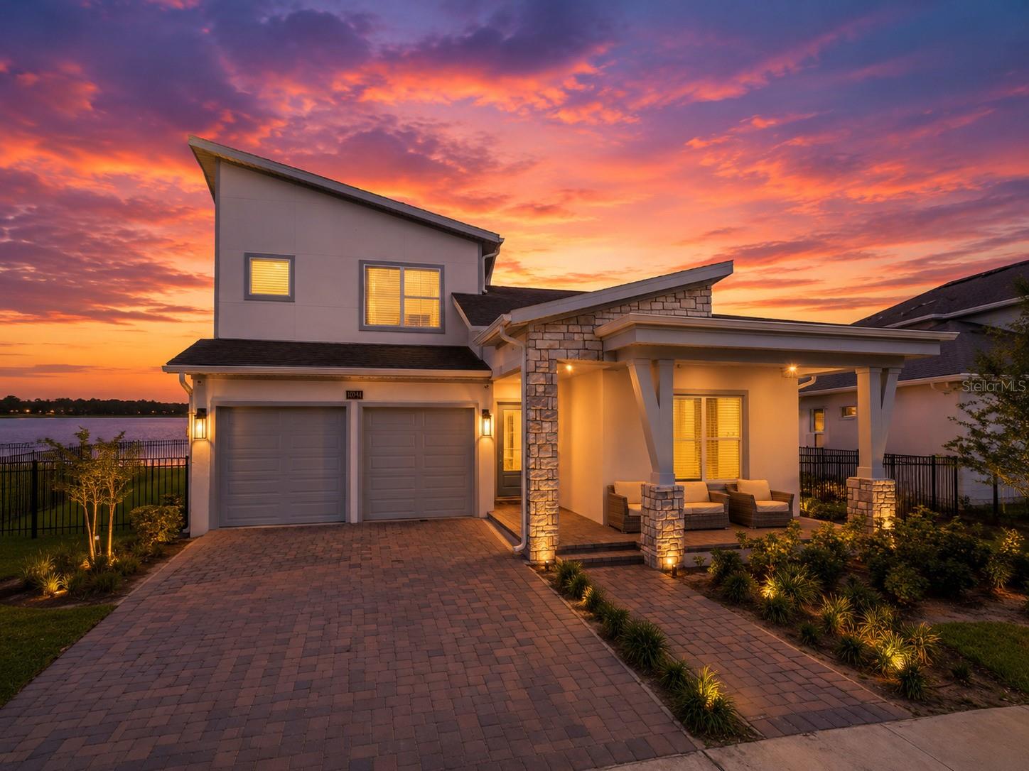 This stunning two story home offers everything you've been looking for, featuring 5 spacious bedrooms, 3.5 luxurious bathrooms, and a highly desirable floor plan with the primary suite conveniently located on the first floor for ultimate comfort and privacy.

Step inside and be impressed by the gourmet kitchen, showcasing stainless steel appliances, 42" cabinetry, quartz countertops, and an oversized center island that serves as the perfect gathering space for family and friends. The home also features elegant laminate flooring throughout the main living areas, plush carpeting in the bedrooms, soaring 10-foot ceilings, 8-foot doors, and a covered brick-paved lanai, providing the perfect space for outdoor dining, entertaining, or simply relaxing while enjoying the peaceful surroundings.

Perfectly positioned in a prime location within Laureate Park, this exceptional property offers beautiful lake views, creating a serene backdrop to everyday living. Whether enjoying your morning coffee or unwinding at sunset, the waterfront setting adds a special touch to this already remarkable home.

Living in Laureate Park means enjoying world-class amenities designed for an active and vibrant lifestyle, including resort-style pools, fitness centers, walking and biking trails, parks, playgrounds, community events, and much more. Conveniently located near Medical City, top-rated schools, Orlando International Airport, shopping, dining, and major highways, this home truly offers the perfect blend of luxury, comfort, convenience, and location.