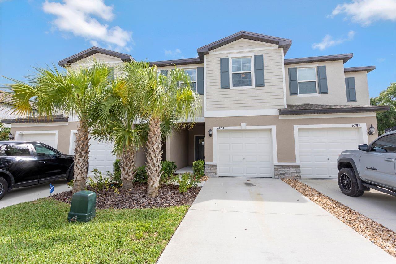 WELCOME HOME! Located in the gated community of The Townes at Lake Thomas, this recently built townhome is sure to check all of the boxes. Just inside the front door, is the spacious living room which is a great space for entertaining guests, and seamlessly flows into the kitchen, equipped with stainless steel appliances and granite countertops. Just off the kitchen through the sliding glass door, is a screened in lanai overlooking the pond in the backyard that makes for the perfect place to enjoy your morning coffee, or a sunset after a long day. On the second level, you are greeted with a functional loft area as well as two guest bedrooms. Down the hall, you'll find the sizable primary bedroom featuring a large walk-in closet, as well as the primary bathroom featuring dual sinks, and a walk-in shower. Community features include a sparkling community pool, dog park, walking trail, and a community dock to view the beautiful sunset over Lake Thomas. This prime and central location allows for easy access to Downtown Tampa, as well as the gulf beaches, and all surrounding areas. Schedule your showing today!