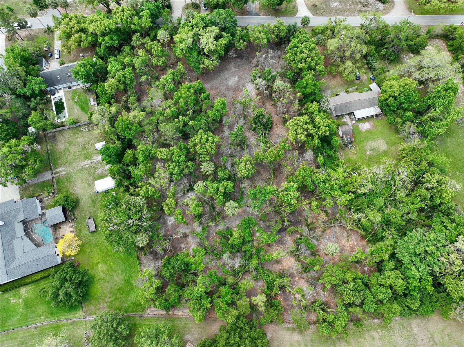 Discover the perfect backdrop for your dream home on this spacious 2.34-acre residential lot. Tucked away in a serene, wooded setting, this property offers the peace and privacy of country living—just a short drive from modern conveniences. Whether you envision a custom-built family residence, a weekend retreat, or a personal sanctuary, this land provides the ideal foundation. With plenty of room for gardens, outdoor entertaining areas, or even a pool, you can design a lifestyle that suits you. Don’t miss this rare opportunity to shape your own slice of paradise. Let your imagination bring it to life! Buyers to verify measurements and set backs.