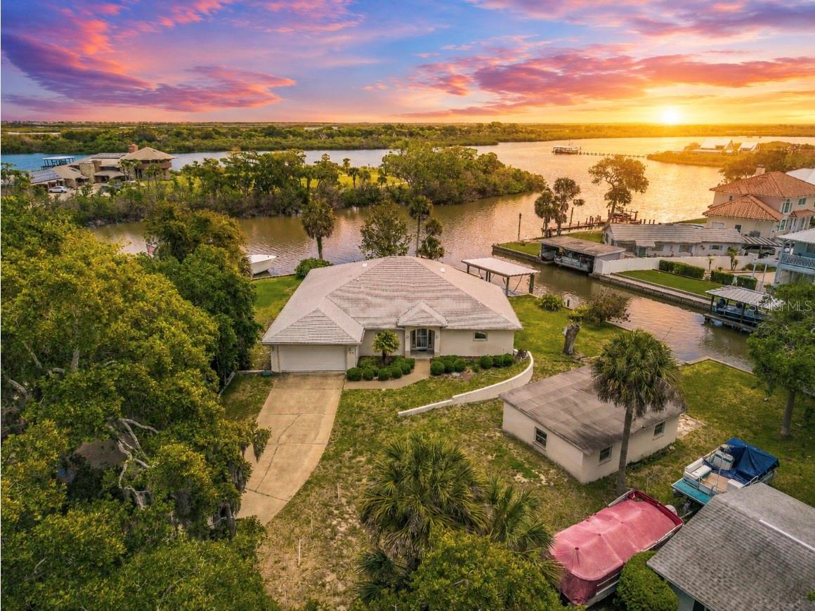 One or more photo(s) has been virtually staged. Welcome to 192 Azalea Road in Waterway Park, where location, lot, and lifestyle come together in a rare waterfront opportunity. Set on approximately .60 acres with over 2,259 square feet of living space, this 3-bedroom, 2-bath single-family home also includes a dedicated office/den and a split floor plan designed for comfort, privacy, and flexibility. Built in 2004, the home offers solid original builder-grade finishes, giving the next owner the opportunity to update, personalize, and elevate the property into a truly standout coastal retreat.  The lot is the showstopper. Positioned on what may be one of the best waterfront parcels in Waterway Park, this property offers expansive water views, a private boat ramp, and direct access for enjoying life on the water. Launch from your own backyard and spend the day boating, fishing, exploring the Intracoastal waterways, or watching the natural beauty that makes this cove so special. Manatees, dolphins, turtles, and breathtaking sunrises are frequent parts of the view here.  With generous outdoor space, a highly desirable waterfront setting, and strong bones, this property is ideal for someone ready to create their own Florida waterfront paradise. Opportunities like this are not easily duplicated.