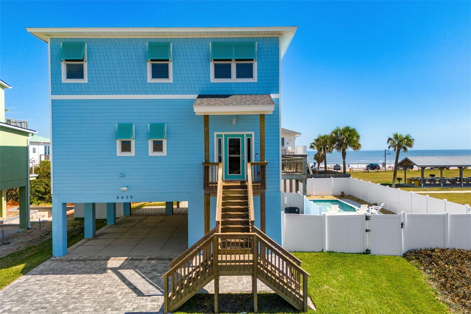 Welcome to a turnkey, income-producing coastal retreat (with NO HOA & no Flood insurance required) in the highly desirable no-drive section of New Smyrna Beach, where privacy, pristine shoreline, and strong returns align.
Built in 2023 on a commercial lot with no nightly rental restrictions, this 4-bedroom, 3.5-bath home comfortably sleeps 10 and has generated $85,000–$90,000 in gross rental income in both 2024 and 2025. Fully furnished and professionally curated, it is completely rental-ready for immediate, seamless operation.
Nearly every room showcases quality furnishings from Ethan Allen (with one bedroom furnished by another vendor). Each bedroom features a 55” smart TV, complemented by a 70” smart TV in the living room. The open-concept design flows into a fully equipped chef’s kitchen stocked with cookware, small appliances, and serveware—truly guest-ready from day one.
Outdoor living is equally impressive, featuring a private heated pool, spacious entertaining areas, and premium Polywood patio furnishings designed to withstand the coastal environment. A fully stocked owner’s closet includes beach gear and pool toys, and a 220V outlet in the carport provides convenient EV charging.
Adding to its exceptional location, a park sits directly across the street offering basketball, tennis, volleyball, playground, fishing, and a kayak launch, while direct beach access is just steps away—an unbeatable combination for guests and owners alike.
With proven income, modern 2023 construction, and a premier no-drive beach setting, this property presents a rare opportunity for investors seeking strong performance and long-term coastal value.
Schedule your private showing today and secure a premier beachside investment in one of Florida’s most desirable coastal communities.