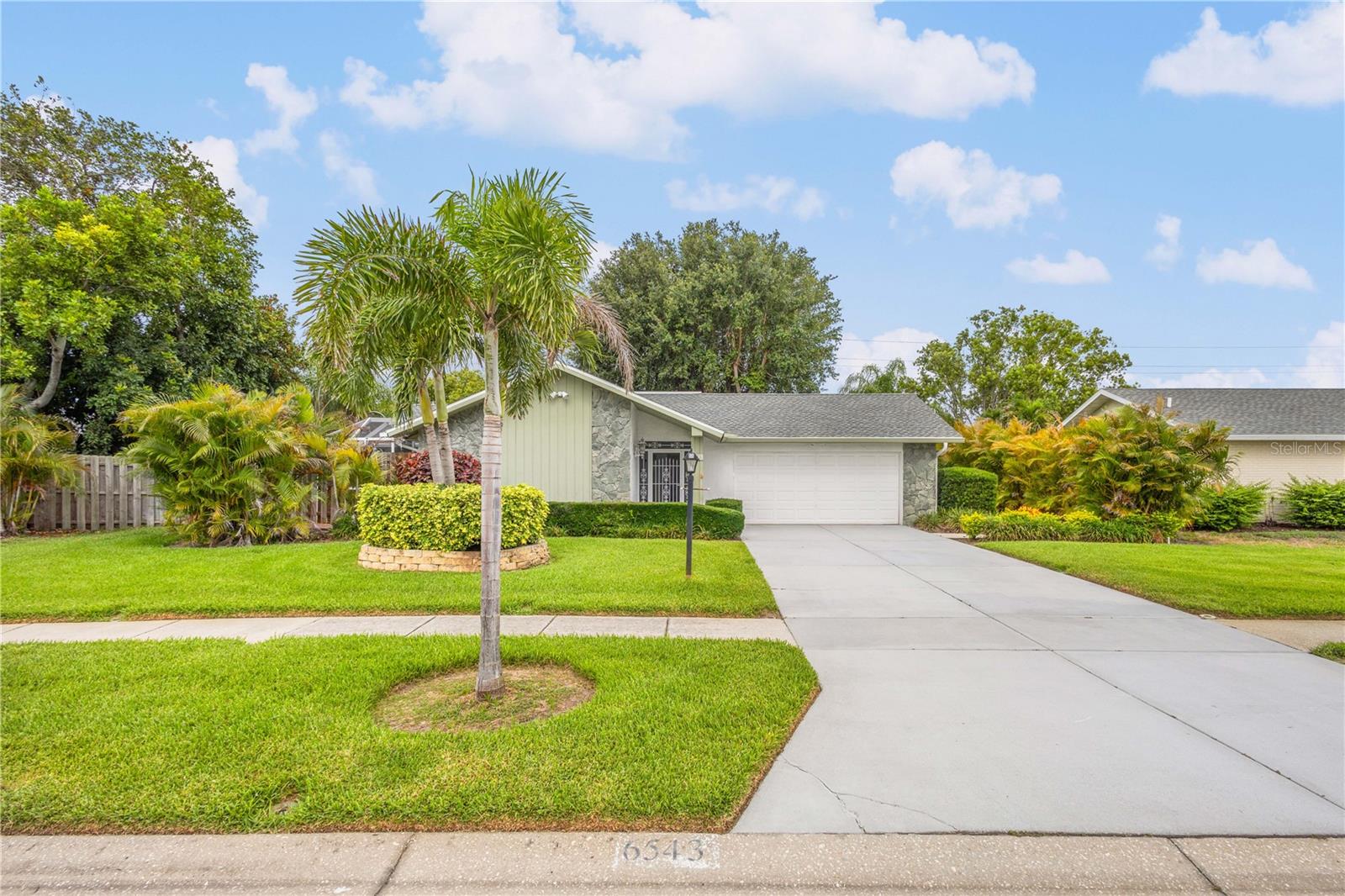 Welcome to this beautifully maintained 3-bedroom, 2-bathroom home with a 2-car garage in the highly desirable Gulf Gate East community. From the moment you step into the spacious foyer, you'll appreciate the bright, open layout designed for comfortable living and entertaining. The expansive great room with vaulted ceilings features a stunning fireplace and flows seamlessly into the renovated kitchen, showcasing quartz countertops, stainless steel appliances, Shaker-style cabinetry, subway tile backsplash, and a large center island with a sink and breakfast bar. Thoughtful upgrades throughout the home include crown molding, recessed lighting, wood-look laminate and tile flooring, and a coffered ceiling in the sunroom/family room. The fenced backyard offers added privacy and outdoor enjoyment, allowing you to relax in your above-ground hot tub, surrounded by the screened lanai. The spacious primary suite offers a custom built walk-in closet and an updated ensuite bathroom with dual vanities and a walk-in shower. The guest bathroom has been beautifully renovated with a spa-inspired design. A well-equipped laundry room includes a washer, dryer, utility sink, storage cabinetry, and an open pantry. Major improvements provide exceptional peace of mind, including: New roof (2024), New gutters with leaf guard (2024), A/C system (2023) and ductwork (2016), Garage door opener (2026), Newer well and updated irrigation system, NEWER windows, sliding doors, front door, and skylight.
Residents enjoy low HOA fees and no CDD fees, while being conveniently located minutes to Siesta Key Beach, downtown Sarasota, shopping, dining, hospitals, airports, and I-75. This move-in-ready home combines modern upgrades, stylish finishes, and an unbeatable location.