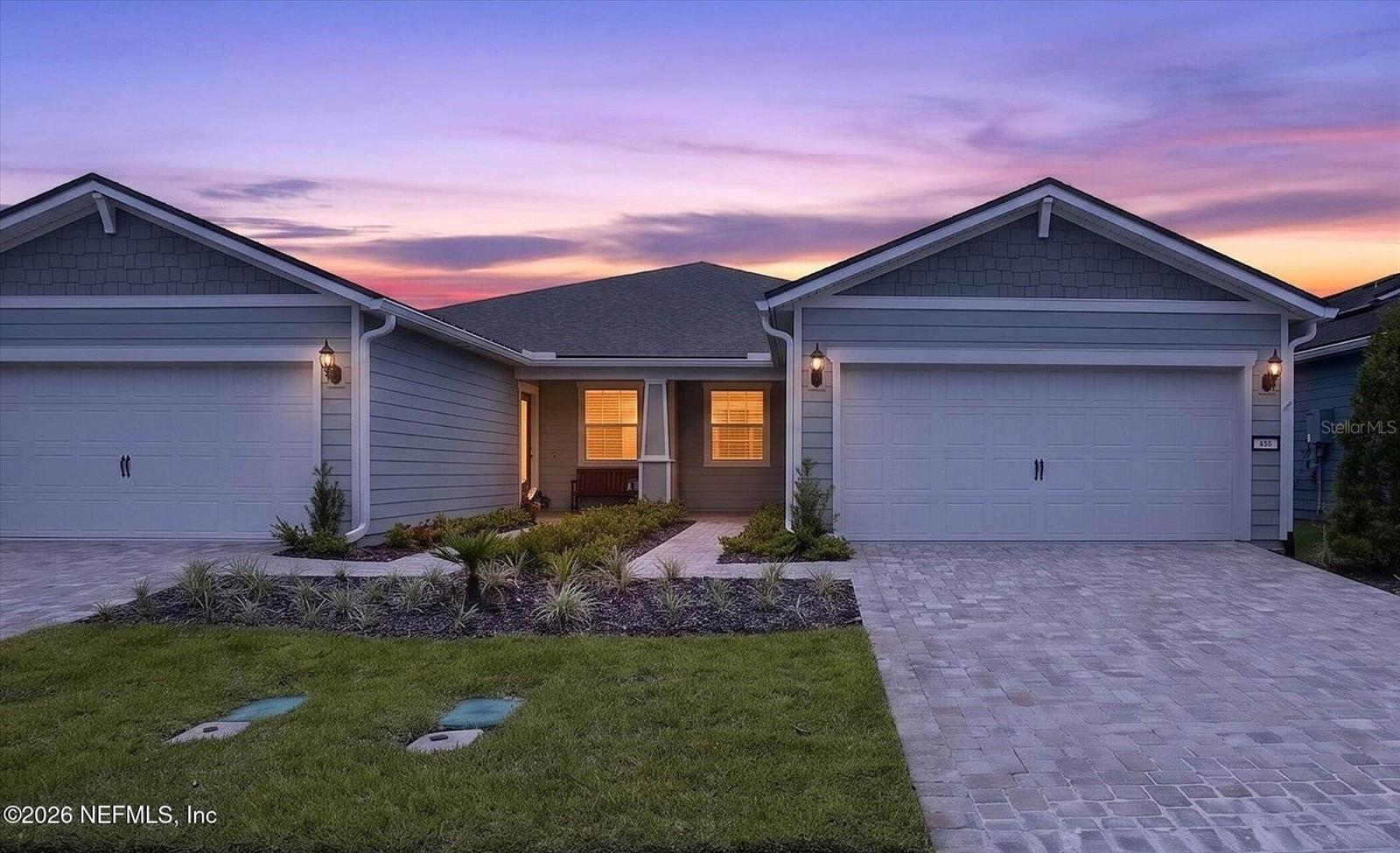 Virtually Staged. Like-new 2024 villa featuring 2 bedrooms, 2 baths, and a versatile flex room in Del Webb Wildlight. This thoughtfully designed home offers an open-concept layout with a spacious great room, dining area, and a gourmet kitchen complete with upgraded countertops, stylish backsplash, and a large center island perfect for entertaining. The private primary suite features a walk-in closet and spa-inspired bath, while the flex room is ideal for a home office, hobby room, or guest space. Sliding glass doors open to a screened lanai for seamless indoor-outdoor living. Residents enjoy resort-style amenities including a pool, clubhouse, pickleball courts, playground, barbecue area, jogging paths, and maintained grounds. Move-in ready with a low-maintenance lifestyle.