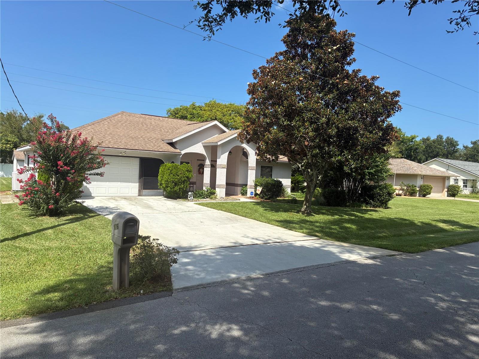 Mature Japanese Plum Trees in an oversized backyard  and lovely Landscaping! This spacious three bedroom split plan offers many upgrades! A gigantic WALK-IN Closet could literally become another room! Both Bathrooms have been remodeled! A new 50 gallon hot water heater in 2023. Newer windows and roof!  2500 1/2 ton Seer AC was added as well!  The Kitchen Cabinets were tastefully replaced and a complimentary backsplash was added!  Newish wood Laminate Floors along with well maintained ceramic tile blend nicely. Kitchen Appliances and Washer/Dryer convey along with some furnishings.  There is also additional shelving in the garage. This home is being Sold As-Is!