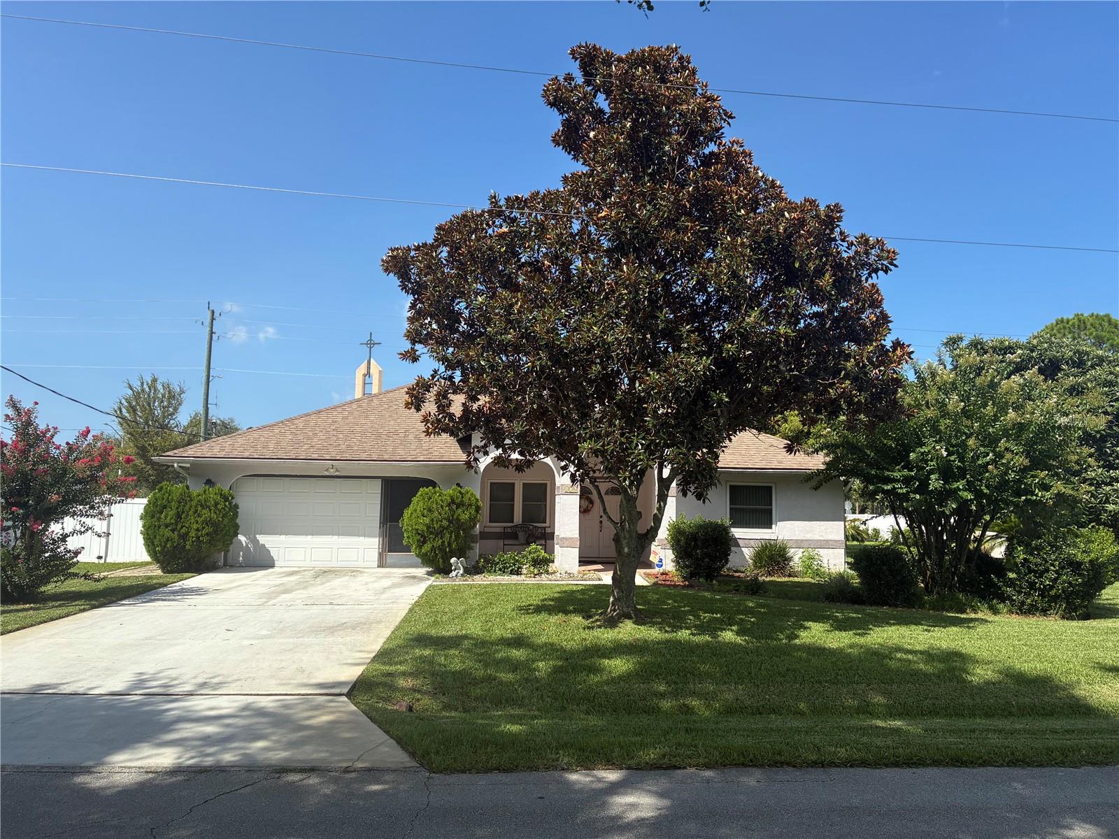 Mature Japanese Plum Trees in an oversized backyard  and lovely Landscaping! This spacious three bedroom split plan offers many upgrades! A gigantic WALK-IN Closet could literally become another room! Both Bathrooms have been remodeled! A new 50 gallon hot water heater in 2023. Newer windows and roof!  2500 1/2 ton Seer AC was added as well!  The Kitchen Cabinets were tastefully replaced and a complimentary backsplash was added!  Newish wood Laminate Floors along with well maintained ceramic tile blend nicely. Kitchen Appliances and Washer/Dryer convey along with some furnishings.  There is also additional shelving in the garage. This home is being Sold As-Is!