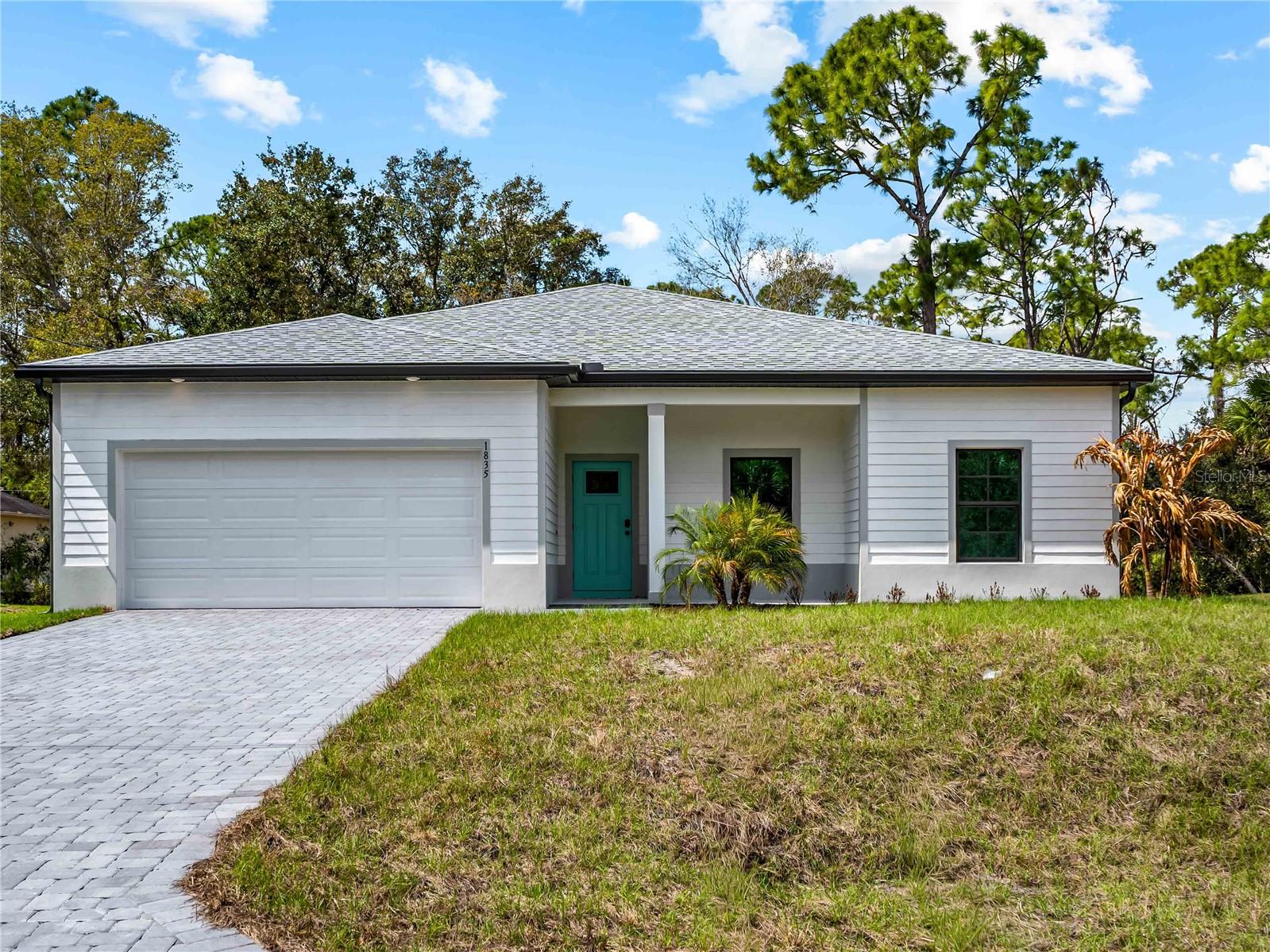 One or more photo(s) has been virtually staged. Tile throughout. Quartz countertops. Impact windows. Paver driveway. Whole-house generator plug. Fully upgraded new construction in North Port.

Flood insurance is not required for this property.

The layout is a 4-bedroom, 2-bath split floor plan with 1,710 square feet of living space. The open kitchen and living area work well for everyday living and entertaining. The primary suite is separated from the three secondary bedrooms, giving you flexibility for guests, a home office, or whatever you need the space to be.

No carpet anywhere. No vinyl. Tile throughout every room.

Impact-resistant windows are already in. The paver driveway is already in. The whole-house generator plug is already in. The builder did not cut corners on this one.

Buyers may be eligible for up to $5,000 in flex cash that can be applied toward closing costs or a rate buy-down.
Backed by a 2-10 Builder's Warranty.

Some photos are of the same floor plan and may not reflect current fixtures or colors in this home.