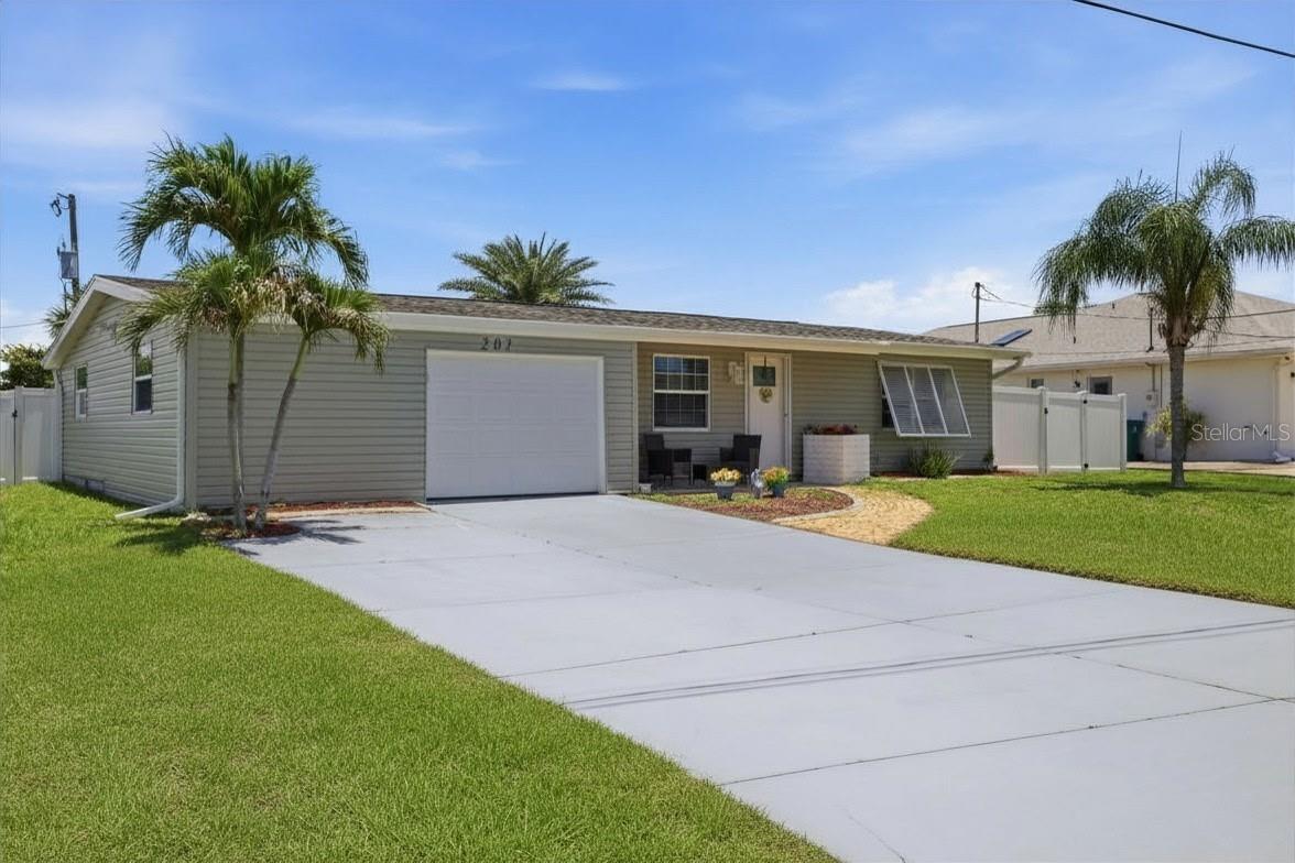 Come check out this beauty. NO HOA's in this lovely home of 1400 +/- SF that  has a large gorgeous bright and airy primary bedroom and is the perfect place to make YOUR dreams come true. You'll love floating in your recently resurfaced HEATED pool with full cage overlooking Spring Lake, a saltwater lake. It is situated on the wide saltwater lake with a short 10 to 15 minute ride to Charlotte Harbor. The property is fenced for privacy and has decking and sunspace on the waterside. The decking is composite so no maintenance needed here! Home has been replumbed, and added hurricane and impact glass so you'll be snug as a bug in a rug in any weather. Don't miss the Florida Family room with light streaming and ample room to use this space for YOUR needs. This property features a single car garage, nicely updated kitchen with newer appliances. This gem waits for you to call it yours.  Remember...no HOA's here. Hurry over