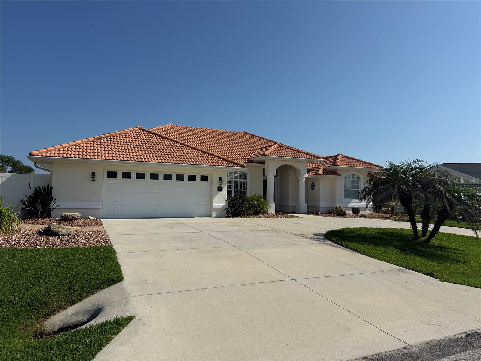Beautifully updated and thoughtfully maintained, this exceptional waterfront home offers the perfect blend of comfort, functionality, and Florida lifestyle living. With an impressive list of major improvements completed over time, this property delivers true peace of mind for today’s buyer. Recent updates include a newer AC/heat pump, whole-home generator, water heater, upgraded ducts and insulation, and a saltwater pool cell converter for enhanced efficiency and convenience. The home has been carefully improved inside and out, showcasing quality updates that reflect genuine pride of ownership.The outdoor living space is a standout feature, designed for relaxing, entertaining, and enjoying life on the water. Highlights include a dock addition, a 10,000 lb boat lift, seawall voids professionally filled with foam by Foundation Pro, a new driveway, and a warm wood patio ceiling that adds character and charm to the covered outdoor area. Whether you enjoy boating, poolside gatherings, or peaceful waterfront views, this home is ready to support an easy and enjoyable coastal lifestyle.Inside, the home has been beautifully enhanced with new tile flooring and multiple thoughtful remodels. The updated kitchen provides a fresh and functional space for everyday living and entertaining, while the remodeled office, laundry room, guest bathroom, primary suite, and primary closet add style, storage, and modern convenience throughout. Additional improvements include a new patio slider, new front door, new primary bedroom doors, pantry shelving, and more. From the saltwater pool and boat lift to the whole-home generator and updated interiors, this move-in-ready waterfront property offers a rare combination of lifestyle, quality, and long-term value. A must-see home with extensive updates already in place.