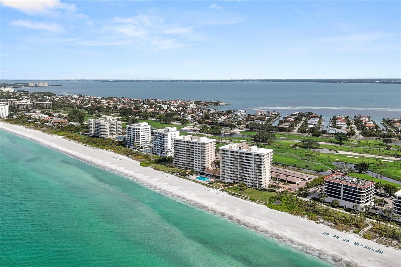 Indulge in the epitome of coastal living within this meticulously designed 2,420-square-foot renovated corner condominium, gracefully perched on the 11th floor on the beach of the Gulf of Mexico. Discover the allure of sweeping vistas capturing the turquoise hues of the Gulf waters and the tranquil allure of Sarasota Bay. Step onto these expansive terraces and feel the gentle Gulf breezes while enjoying the stunning views. This is an extension of your living space. Dine al fresco with a backdrop of the shimmering Gulf, savor your morning coffee as the sun rises over the horizon, or simply unwind in the glow of our famous sunsets over the Gulf. As daylight fades, see the sparkling lights of downtown Sarasota come to life across the bay. This residence features a spacious open floor plan, an inviting kitchen with a substantial island, and three bedrooms with accompanying full baths, each meticulously designed for both luxury and functionality. The soothing color palette of this home reflects the coastal landscape, forging a seamless connection between indoor and outdoor living. Thoughtfully designed, this home provides built-ins, ample storage, and a utility/laundry room. Longboat Towers is located behind the gates of the Longboat Key Club and has its own 24-hour attended gatehouse. There is a beautiful private pool for the community, a gym onsite, and a community club room for social gatherings. The beach has lounges and umbrellas ready for you to enjoy. This is more than a condominium- it's a sanctuary where luxury, comfort, and captivating views converge. Seize the opportunity to make this extraordinary property your own, where every moment is a celebration of the coastal lifestyle, enhanced by close access to the restaurants and arts scene in downtown Sarasota. With the purchase of membership to the Longboat Key Club, you have access to over 55 holes of golf, five exclusive restaurants, a world-class tennis/pickleball facility, and a luxury spa and gym.