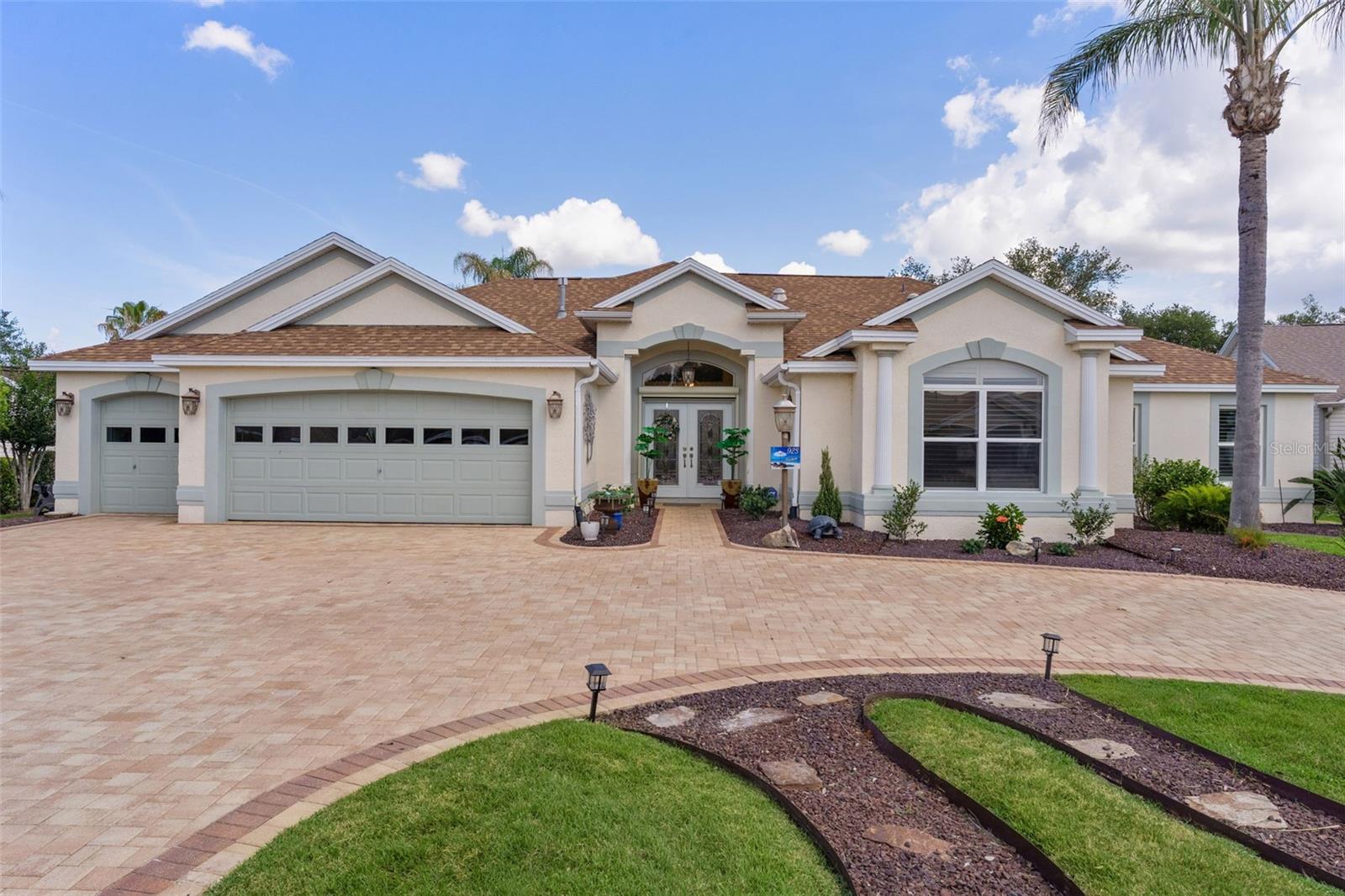 ~NO BOND~ ~SALTWATER POOL AND FOUNTAIN~ ~2024 ROOF~ ~ 2026 HVAC~ ~CUL-DE-SAC~ ~2025 248sf ADDITION~ ~OUTDOOR KITCHEN~ ~GARAGE ELEVATOR~ Stunning 5/4 EXPANDED and CUSTOMIZED LANTANA in the highly sought-after Village of VIRGINIA TRACE! Nestled on a private CUL-DE-SAC homesite, this exceptional POOL HOME offers the perfect blend of luxury, space, and functionality with a recent addition and an incredible layout designed for entertaining and everyday living. Outstanding curb appeal welcomes you with mature landscaping, a CIRCULAR DRIVEWAY and a 2-car plus GOLF CART GARAGE.  Step inside to soaring HIGH VAULTED knockdown ceilings, CROWN MOLDING and PLANTATION SHUTTERS throughout, CERAMIC tile flooring in the main living areas, and an elegant open-concept design. The spacious living room features an UPGRADED CEILING FAN and decorative cornices, while the gourmet kitchen has UPGRADED cabinetry, GRANITE countertops, STAINLESS STEEL appliances, 2026 JENN-AIR stove and cooktop, TILE backsplash, under-cabinet lighting, recessed lighting, pendant lighting, 2 closet pantries, PULL-OUT DRAWERS, and a sunny eat-in area. The luxurious primary suite offers plush carpeting, recessed lighting, UPGRADED ceiling fan, SOARING ceilings, and 2 OVERSIZED WALK-IN CLOSETS, including one CUSTOM-DESIGNED CLOSET. The spa-like ensuite bath features CERAMIC tile, a TILED walk-in shower, garden tub, DUAL sinks, separate water closet, UPGRADED cabinetry, and QUARTZ countertops. Guests will appreciate the split-bedroom design with spacious guest bedrooms featuring HARDWOOD flooring, VAULTED ceilings, UPGRADED ceiling fans, built-ins, MURPHY BEDS, MINI-SPLITS, and custom workspace areas. Baths are beautifully UPGRADED with TILED showers, QUARTZ or CORIAN countertops, DUAL sinks, and UPGRADED cabinetry. The INDOOR LAUNDRY ROOM includes LUXURY VINYL flooring, LG washer and dryer, 2 large storage closets, and a built-in ironing board. The new office also has LUXURY VINYL flooring, a mini-split and a Murphy Bed. Step outside to your private backyard oasis featuring a COVERED LANAI and BIRDCAGE with MOTORIZED BLINDS, a REFINISHED SALTWATER POOL with NEW TILE, UPGRADED pool equipment, SHARK-COATED POOL DECKING, and a fully equipped OUTDOOR KITCHEN with grill, refrigerator and sink — the ultimate Florida entertaining space! The garage features a laundry tub, refrigerator, CENTRAL VACUUM system, and an ATTIC ELEVATOR for total convenience. There are new lighting fixtures and fans throughout, the inside and outside was just repainted and the driveway was recently redone. The Hot Water Heater is 2015. This one-of-a-kind Virginia Trace home combines luxury upgrades, incredible flexibility, and resort-style outdoor living all in one spectacular property. Minutes from Lake Sumter Landing, Virginia Trace Pool & Rec Center, Lake Miona Rec Center, and Mallory Hill Country Club. You have shopping, dining and entertainment in Lake Sumter Landing, but you also have it along with medical being close to CR466!