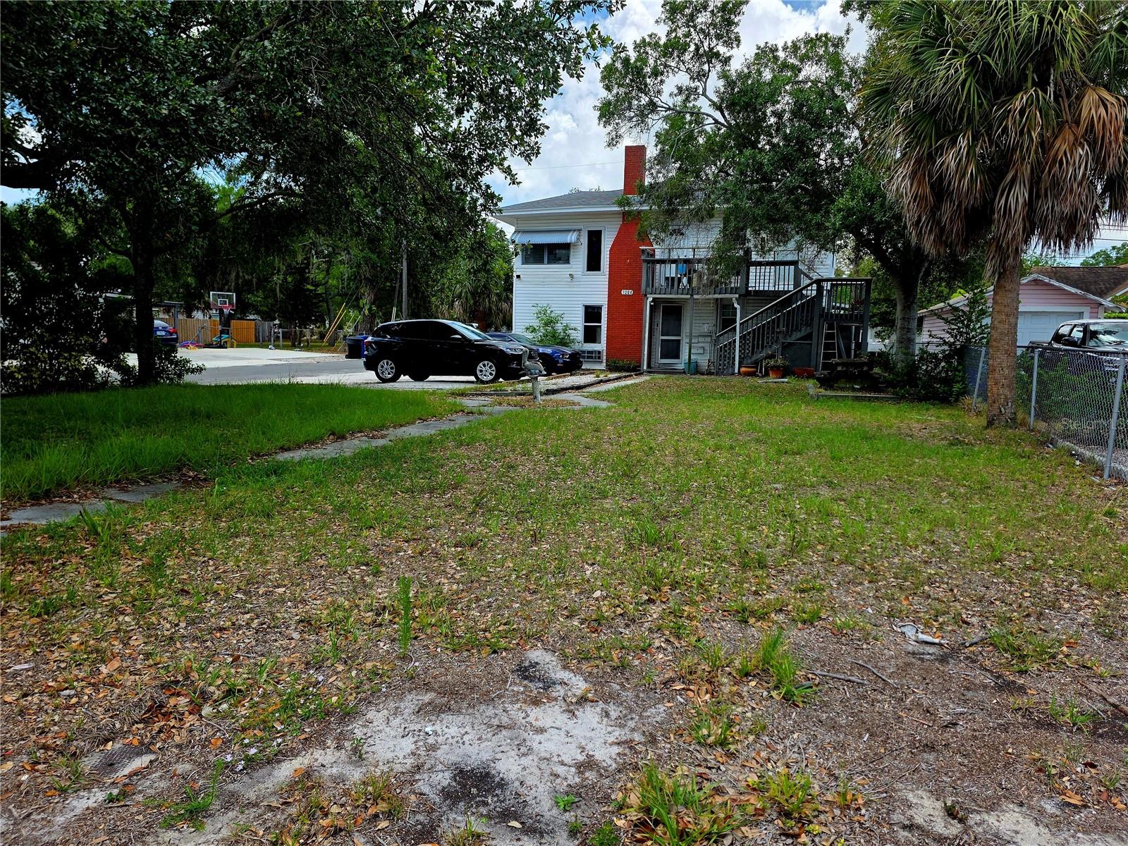 Investor opportunity in the heart of Northeast St. Petersburg! This triplex at 1204 38th Ave N offers strong income potential with a versatile layout and future upside. The standout feature is the spacious upstairs 2-bedroom unit boasting cathedral ceilings, creating an open, airy feel that’s highly desirable for tenants or owner-occupants alike.  Situated on a large lot, the property presents a rare opportunity for expansion—explore the potential to add additional units or enhance outdoor living spaces (buyer to verify zoning and development possibilities). Whether you’re looking to generate immediate rental income, live in one unit while renting the others, or maximize value through redevelopment, this property checks multiple boxes. Located in a high-demand area of St. Petersburg, close to downtown, shopping, dining, and major roadways, this is a prime addition to any real estate portfolio.