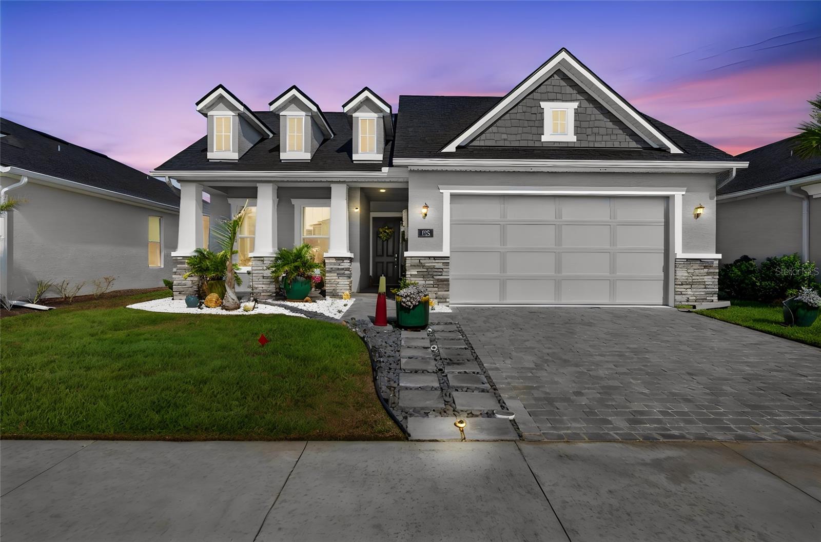 Better than new and loaded with upgrades, this 2-year-old Avery II floor plan lets you skip the delays, added costs, and stress of building. Move right in and enjoy a fully finished home complete with window treatments, upgraded features, and thoughtful details already in place. Located in the vibrant master-planned community of Mosaic, this home offers 3 bedrooms, 2 baths, a private office or flex room, and a desirable split floor plan designed for ideal everyday living.  The open layout showcases breathtaking lake views from the living room, kitchen, dining area, and primary suite, creating a bright and inviting space throughout. The kitchen is a true centerpiece with an oversized tile-wrapped island, wall oven, cooktop, microwave, refrigerator with two ice makers, and a spacious pantry. Upgraded ceiling fans, tinted windows, and quality finishes enhance both comfort and style, while the extended lanai is the perfect place to unwind and take in the water views.  The primary suite offers privacy and serene lake views, while a separate laundry room adds convenience. Additional highlights include epoxy-coated garage floors, a 2-car garage with large overhead storage lofts, irrigation system, and a Generac generator scheduled for installation.  Living in Mosaic means more than just a home, it’s a lifestyle. Enjoy monthly events like Pet Palooza, food trucks, and community social gatherings, along with a resort-style pool, fishing dock, and playground.  Perfectly positioned near Tomoka Town Center for shopping, dining, and entertainment, with quick access to I-95 and I-4, and just a short drive to Daytona Beach, home of the World’s Most Famous Beach.  Why wait to build when everything is already done for you—this is the move-in ready, upgraded home buyers are looking for.  Seller is offering $5000 towards buyers closing costs