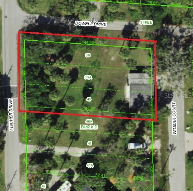 Vacant lot with garage and carport.  Electricity, Plumbing and Sewer all connected. Vacant lot next door available as well.  And home next to that is also available.  Build your compound.