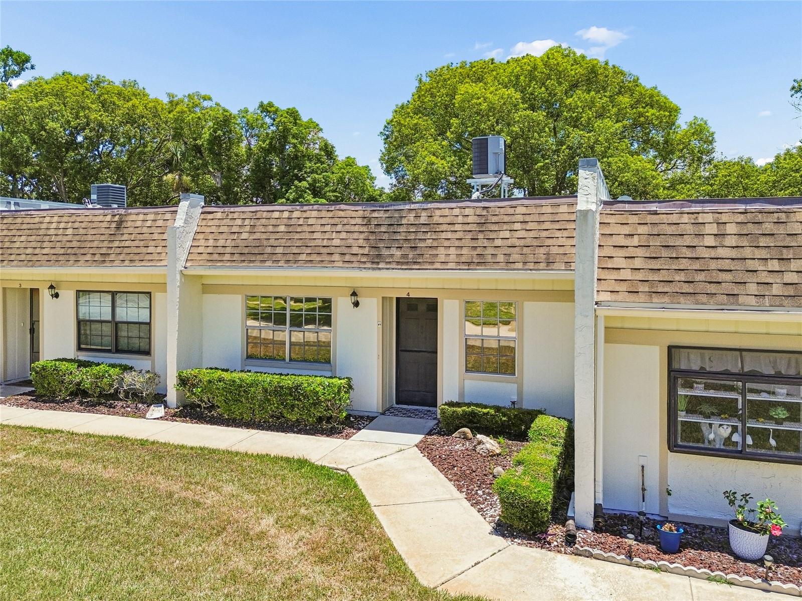 This beautifully furnished 2-bedroom, 2-bathroom condominium is located in the desirable Timber Oaks Fairway Villas community of Port Richey, FL. Offering a seamless blend of comfort and convenience, this move-in ready home features an open, light-filled floor plan perfect for both relaxing and entertaining. The true highlight is the spacious, enclosed screened in back patio, providing the ideal private oasis to enjoy warm Florida breezes, morning coffee, or peaceful evening sunsets without the worry of bugs. Designed for low-maintenance living, the property includes convenient covered carport parking. Residents of Timber Oaks also gain access to fantastic community amenities including a clubhouse, tennis courts and a sparkling swimming pool. Whether you are looking for a permanent residence or a seasonal winter getaway this beautifully appointed condo delivers the perfect slice of the Florida lifestyle.