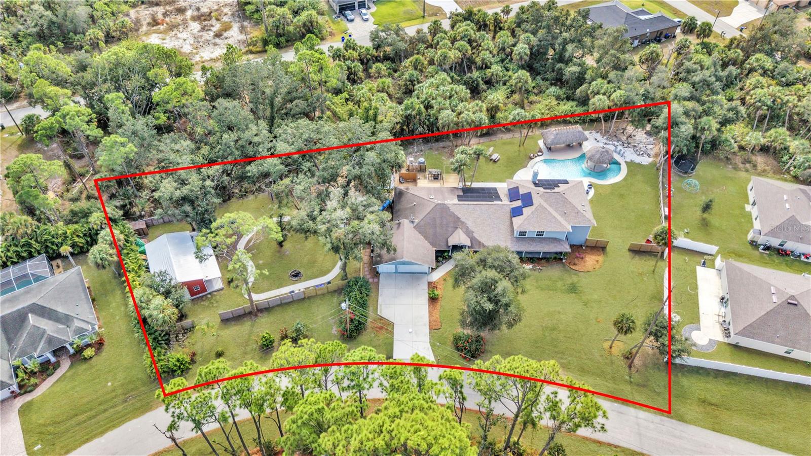 Multigenerational home over 5500 sqft. back on the market with a NEW roof! This spacious home offers 6 bedrooms, 4 bathrooms, and multiple bonus rooms. A major renovation was completed in 2023, adding more than 2,000 sq. ft. to the home, creating a large pool and cabana area, and installing a new roof with many additional upgrades. 

From the moment you step onto the welcoming front porch spacious enough for rocking chairs to enjoy your morning coffee, you’ll feel the warmth and character of this exceptional property. Inside, the home features open ceilings and skylights that bring in natural light highlighting its modern, distinctive design. Multiple living spaces offer unmatched versatility, including a cozy family room including over 20-foot ceilings, a comfortable living room, a bright sitting room, and a formal dining room perfect for gatherings. 
The expansive kitchen is a chef’s delight, featuring abundant cabinet storage, granite countertops, two refrigerators, a generous center island, providing plenty of workspace for cooking and gatherings. Convenient access to one of the home's two laundry areas is located just off the kitchen.

The first-floor master suite offers privacy and generous space, along with a walk-in closet.

The second-floor master suite is located off a large loft area and includes its own private bathroom with an enclosed stone tub, a separate walk-in shower, a second laundry area, and a custom large master closet. 
Enjoy Florida living at its finest with a sparkling large swimming pool, complete with an beach style “island” cabana perfect for lounging or entertaining. The fenced backyard is designed for outdoor enjoyment and a playground area, and a concrete path suitable for bicycles, rollerblades, and other activities. A metal barn/shed was also added in 2024 for additional storage or workspace.

Located minutes from Wellen Park and CoolToday Park, the home offers quick access to dining, recreation, and community events. I-75 and local Gulf Coast beaches are a short drive away, making this a convenient location for travel, work, and leisure.

Schedule your own personal tour today!