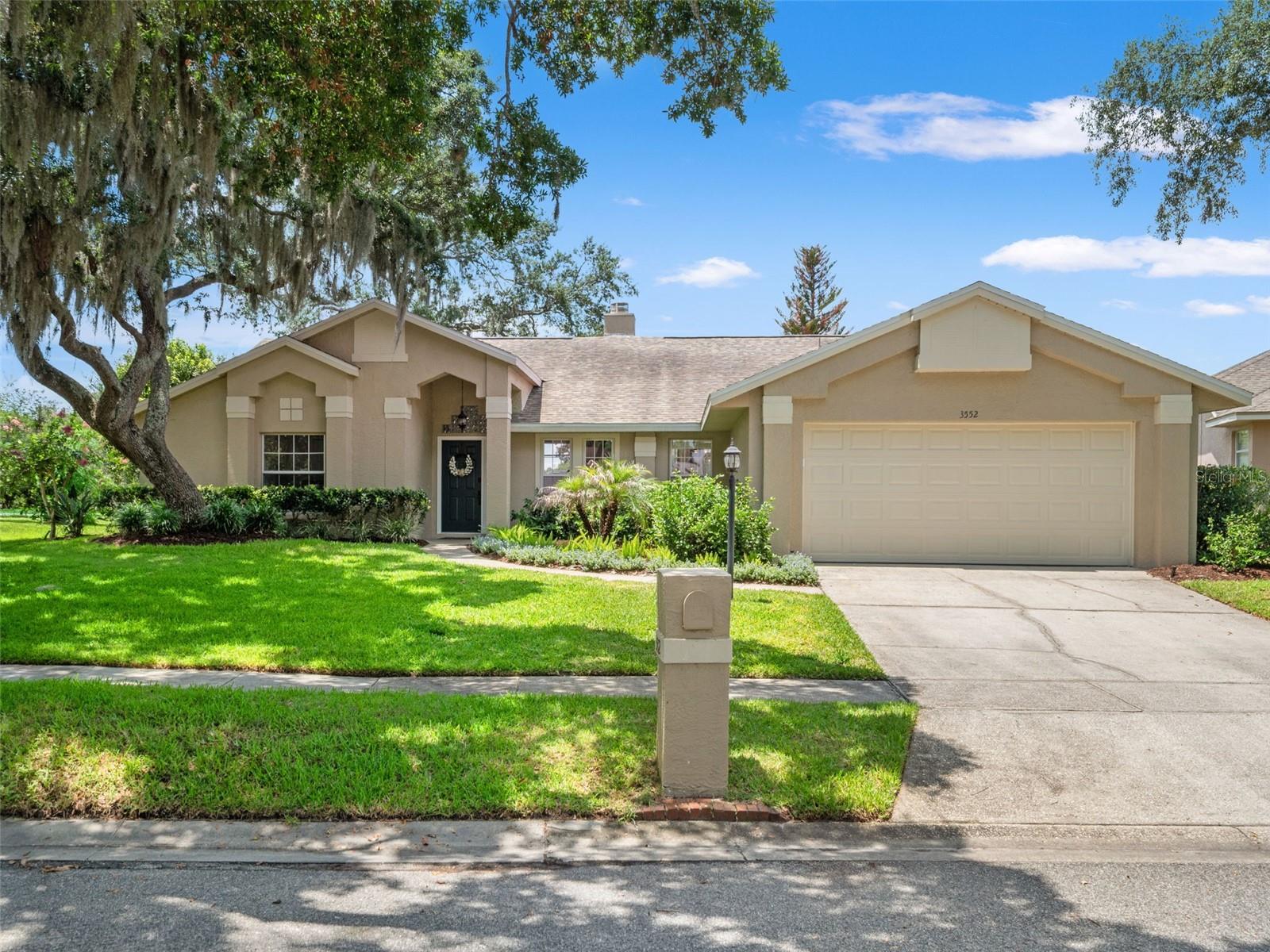 Welcome to one of Oviedo's most desirable locations, perfectly positioned near UCF and zoned for top-rated Seminole County schools, including walking distance to Carrillon Elementary and Hagerty High School. This beautifully updated home offers a spacious open-concept floor plan with a desirable split-bedroom layout and custom touches throughout. The renovated kitchen features quartz countertops, stainless steel appliances, a large center island, and a custom built-in buffet providing both style and functionality. The kitchen flows seamlessly into the living and dining areas, highlighted by a stunning double-sided fireplace that creates character from multiple living spaces. Tile flooring extends throughout the main living areas, while luxury vinyl plank flooring adds comfort and durability to the bedrooms. The generously sized primary suite serves as a private retreat, complete with a walk-in closet and a spacious en-suite bath featuring dual vanities, a whirlpool garden tub, and a separate walk-in shower. Secondary bedrooms are nice sized and split from the Primary Suite. Step outside to a large screened lanai overlooking a peaceful pond, creating the perfect setting for morning coffee, outdoor dining, or simply unwinding while enjoying the view. Roof replaced in March 2019. Living in Oviedo means enjoying an exceptional lifestyle with nearby parks, scenic walking and biking trails, tennis courts, community events, and convenient access to shopping, dining, major employers, and the University of Central Florida. Combining location, updates, top schools, and tranquil water views. Be sure to watch the video and call for a private showing.