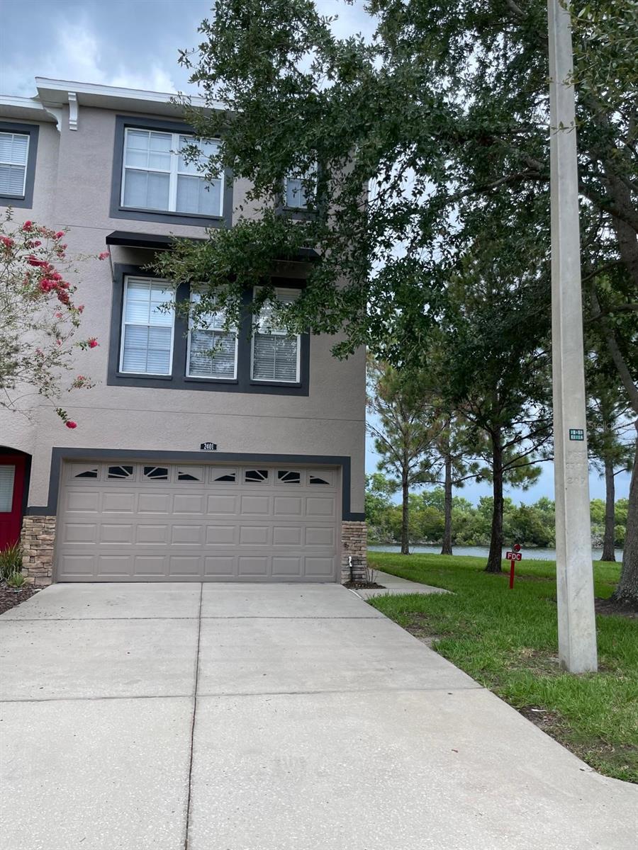 Corner unit / Amazing Views.    2000 sq foot lovely townhome with brand new roof and AC (paid in full).   Features (3) bedrooms, (3) full bathroom and (1) 1/2 bath with a full size two car garage. This beautiful townhome has newer Laminate flooring throughout the whole house. Amazing views of lake and green areas will take your breath away.  Corner unit is a 3-story townhome and backs up to lake and conservation area for total privacy.   Has 3 master bedrooms boasting walk in closet and each has their private full bathroom. The 1st story has a spacious bedroom with a full private bathroom and leads right out to the backyard overlooking the views. Nice and bright with plenty of windows for natural lighting. Second floor has spacious living room for entertaining.  Kitchen has large center island. Washer and Dryer in unit.   Location is close to interstate, shopping and close to Brandon Mall, restaurants and more. Has community pool & club house.