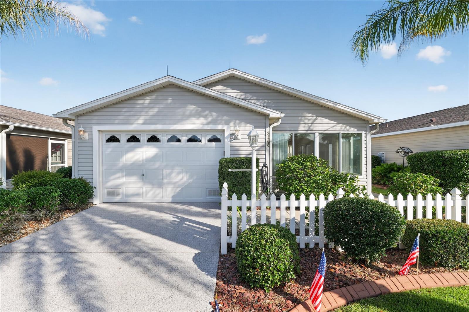 Enjoy the ease of Florida living in this TRANSFORMED and UPDATED, LUX TURNKEY, 2BED/2BATH, 1298SF Cabot Cove Patio Villa! This home has undergone a MAJOR TRANSFORMATION! Enjoy BRAND NEW LUXURY VINYL PLANK flooring throughout the entire home, FULL INTERIOR PAINT JOB — INCLUDING the garage and baseboards! There are fabulous, high quality DESIGNER WINDOW TREATMENTS along with professionally CURATED FURNISHINGS, ART AND DECOR that create a bright and relaxing Florida retreat! "Is this TURNKEY?" YES! A LUX TURNKEY THAT BUYERS WILL LOVE! IDEALLY LOCATED in the Village of Duval - between County Roads 466 and 466A and JUST MINUTES from BOTH Lake Sumter Landing and Brownwood Paddock Square. This villa is updated which provides peace of mind, including a NEW ROOF (2021), HOT WATER HEATER (2018), HVAC (2014), GAS STOVE, whole-house NOVA WATER FILTRATION SYTEM, QUANTUM FIBER INTERNET, LIGHTENING PROTECTION SYSTEM, GUTTERS, GLOSSY EPOXY GARAGE FLOORS and nicely PAINTED DRIVEWAY and much more.The design flows from room to room effortlessly with abundant natural light from THREE SOLAR TUBES. An enclosed lanai with LARGE, GLASS WINDOWS and screens provides a fun, flexible space for anytime of the year. The spacious kitchen features GAS STOVE, abundant cabinetry, a huge pantry, and convenient INSIDE LAUNDRY.
The primary bedroom suite offers a generous size with plenty of room for a king bed, huge walk-in closet and private water closet. While guests will enjoy the comfortable, charming second bedroom with closet and adjacent full bath with a tub/shower combination.
The ONE AND A HALF Car Garage is equally impressive and roomy with custom cabinetry and built-in workbench, pull down attic stairs and tall storage cabinets. Solar Panels provide added energy efficiency and long-term value. Outside, you'll appreciate the professionally landscaped yard, painted concrete driveway, and private outdoor patio—perfect for relaxing or entertaining. Conveniently located just 0.4 miles to the Duval Adult Pool and Mail Station, SEABREEZE Regional Rec Center .2 miles away, 3.4 miles to Lake Sumter Landing Market Square™, and approximately 4 miles to Brownwood Paddock Square™, you'll enjoy easy access to golf, recreation, shopping, dining, and nightly entertainment.
This is not just another patio villa—it's a beautifully transformed home. Simply move in and start enjoying The Villages lifestyle!