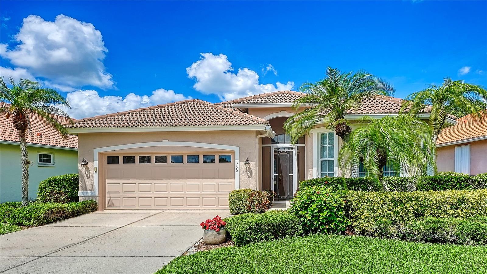 Enjoy lake views from this wonderful home in the Arbors at Pelican Pointe Golf & Country Club. Designed for comfortable Florida living, the spacious living room showcases open views of the water and provides an inviting setting for relaxing or entertaining. The kitchen flows seamlessly into an additional dining area overlooking the lake, creating the perfect space for everyday meals and gatherings. The primary suite also enjoys peaceful water views and features a stylishly updated bathroom. A guest bedroom and bath are thoughtfully positioned at the front of the home, offering comfort and privacy for visitors. A versatile den with French doors and a generous closet can easily serve as a third bedroom, home office, or hobby room. Recent updates include fresh exterior paint and brand-new carpeting, creating a bright and welcoming atmosphere throughout. Step outside to the screened lanai, an ideal spot for morning coffee, outdoor dining, grilling, or simply unwinding while taking in the tranquil views. Additional features include replumbing, a spacious backyard, screened front entryway, laundry room with cabinets and sink, and durable, easy-to-maintain epoxy flooring in both the 2-car garage and lanai. Your social membership provides access to Pelican Pointe’s impressive amenities, including a vibrant clubhouse with restaurant and bar, pro shop, fitness center, tennis and pickleball courts, and a heated lap pool. Beautifully landscaped grounds, nature preserves, and a premier 27-hole championship golf course complete the resort-style atmosphere. The HOA fee includes lawn maintenance, cable, internet, security, and professional management, allowing for truly carefree living. Known for its welcoming atmosphere, active social calendar, and exceptional amenities, Pelican Pointe is one of Venice’s most sought-after communities. Ideally located just minutes from historic downtown Venice, Gulf beaches, shopping, dining, and medical facilities, this home offers the perfect combination of luxury, comfort, and convenience.