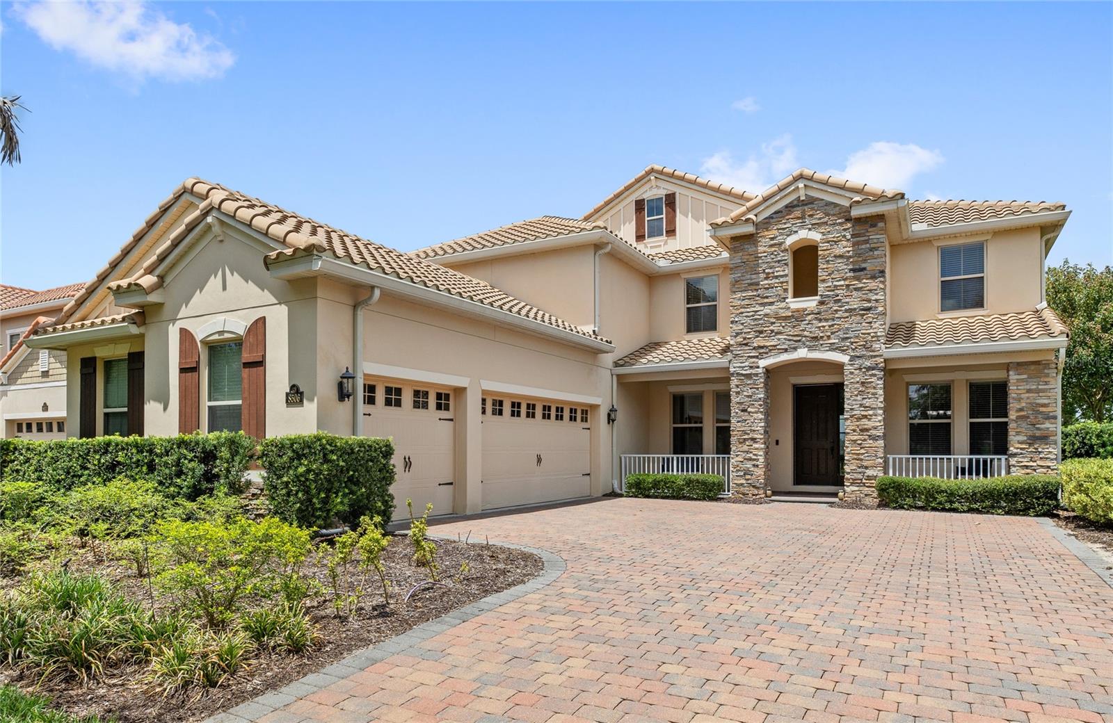 LAKEFRONT living with TWO PRIMARY SUITES, this one has it all. Tucked into the highly desirable Phase 1 of Waterleigh, this Emerald Homes former model sits right on HICKORYNUT LAKE with unobstructed water views, plus two of the three secondary bedrooms enjoy DISNEY FIREWORKS VIEWS every night. Featuring 5 bedrooms, 5 bathrooms, a tile roof, and an oversized 3 car garage.
Inside you'll find wood look tile floors, a flex space perfect for an office or playroom, and a formal dining room. The kitchen features quartz countertops and stainless steel appliances. The casual dining nook overlooks the lake, making every morning coffee feel like a getaway.
The first primary suite sits on the main level near the pool bath, with a walk-in closet, soaking tub, and dual sinks with quartz counters, ideal for guests or multigenerational living. Upstairs, the second primary suite steals the show with an elevated lake view, an oversized walk-in closet, and a spa-style bath with dual vanities and a separate water closet.
A spacious loft offers an additional living space or game room. Outside, the pool deck sets the stage for sunset evenings by the pool and hot tub overlooking the lake.
Waterleigh's HOA takes care of your landscaping and lawn maintenance, and the community offers a resort-style clubhouse pool, mini golf, beach volleyball, walking trails, and a dog park nearby, all just minutes from the 429 and Disney. Schedule your private tour today.