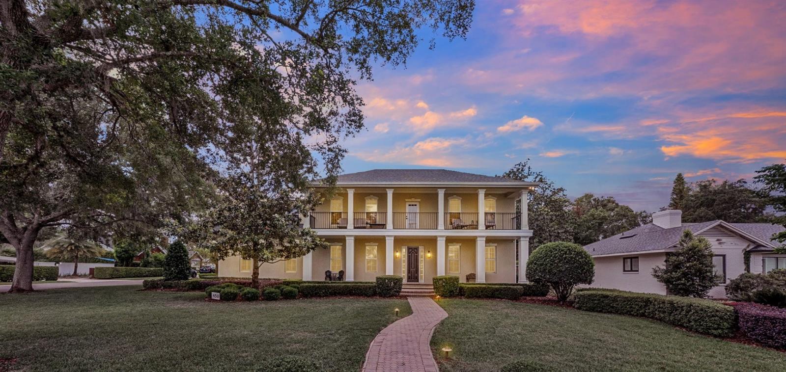 Sophisticated Lakeside Living in the Heart of Winter Park!  Experience the pinnacle of Florida luxury in this meticulously renovated estate, perfectly situated within walking distance of the world-class dining and boutiques of Park Avenue, views of Lake Osceola with easy lake access, with a coveted Winter Park location and top notch schools. 

This 5-bedroom, 4-full and 2-half-bath pool home residence offers an enviable blend of timeless architecture and modern refinement.
The interior has been updated and maintained to the highest standards. The home’s open-concept floor plan is anchored by rich, newer solid wood flooring and elegant plantation shutters throughout. At the heart of the home, the chef’s kitchen is a culinary masterpiece featuring, pristine quartz countertops, high-end stainless steel Bosch appliances, natural gas range, double ovens, and a walk-in pantry. A sophisticated entertainer’s bar area off the kitchen is equipped with a 100+ bottle dual-zone wine cooler, beverage cooler, ice maker, and service sink. This area is open to the kitchen an living areas for easy entertaining or catering.

The newly reimagined primary retreat is a spa-like sanctuary, showcasing white marble tile, a frameless glass shower with dual rainfall heads, a deep garden soaking tub, double vanity areas with new quartz counter tops, new mirrors and lighting and a bespoke walk-in closet. The primary walk in closet was just updated with a top of the line shelving and storage system for easy organization.  The home's floor plan is thoughtfully designed for flexibility, featuring a second primary suite on the main level. Back upstairs, you will find three additional guest bedrooms and two additional full bathrooms, a versatile bonus/flex room over the garage and a private balcony offering serene lake views.  The bonus room has endless possibilities and can be used as a recreation room, movie theatre, exercise room, play room, or in-law/nanny quarters as the second back staircase could be a private entry.

Outdoor Oasis & Infrastructure Designed for seamless indoor-outdoor living, the rear grounds feature a covered lanai over looking the pool.  The covered lanai offers a living and dining area, a newly built-in outdoor kitchen with a professional grill, and a paver-lined patio surrounding a sparkling pool and gas fire pit gazebo sitting area on the other side of pool area.  Plenty of yard space to throw the football, practice soccer skills or throw the frisbee with fido!!

Exceptional Features Include: Mechanical Integrity: Roof replaced in 2020; updated A/C systems (2016/2019); Rinnai tankless natural gas water heater, brand new primary bathroom, all bathrooms have been refreshed, recently updated kitchen, newer solid wood floors throughout.

Storage & Utility: 3-car garage with extended bays for extra storage, oversized closets throughout, and two convenient staircases.

Cozy Accents: 2 fireplaces with one being wood-burning and one gas. Three distinct breakfast/dining areas within the kitchen plus formal dining.

This is more than a home; it is an invitation to the quintessential Winter Park lifestyle you have been dreaming of living!