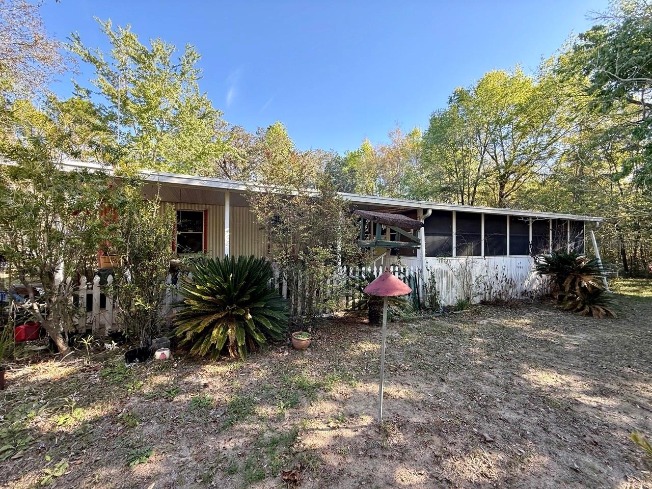 One or more photo(s) has been virtually staged. Great investment opportunity! A fixer-upper 2/2 1993 single wide on over 1/2 an acre in a quiet neighborhood between Bronson and Williston.