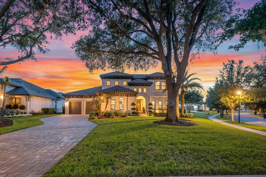 A Remarkable Residence nestled within the prestigious gated community of The Preserve at FishHawk Ranch, this exceptional home sits on an oversized corner lot nearly a 1/2 Acre and offers luxury living at its finest. Stunning Mediterranean-inspired curb appeal welcomes you with lush landscaping, an extended paver driveway, a tile roof, and a spacious three-car garage. Inside, the open-concept floor plan immediately draws your eye through triple sliding glass doors to the sparkling pool and outdoor oasis beyond. A private home office with custom built-ins sits behind French doors off the grand foyer, while an elegant formal dining room connects to the beautifully remodeled gourmet kitchen through a convenient butler’s pantry. The kitchen is a true showpiece, featuring stainless steel appliances, including a built-in oven and microwave, an oversized center island with breakfast bar seating, soft-close white cabinetry with crown molding, tile backsplash, and a walk-in pantry. The spacious great room is highlighted by soaring transom windows, triple sliders, and a dramatic floor-to-ceiling stone gas fireplace. The luxurious owner’s retreat offers coffered ceilings, abundant natural light, private lanai access, dual custom walk-in closets, and a spa-like bath with separate vanities, a freestanding soaking tub, and a walk-in shower. Two additional first-floor bedrooms each feature walk-in closets and private baths, complemented by a convenient media/homework station. Upstairs, a large bonus room/loft and a fourth bedroom with its own bath and walk-in closet create the perfect guest or teen suite. Outdoor living reaches another level with an expansive paver lanai with a built in fire pit surrounding a resort-style pool and infinity-edge spa complete with fountains and a sun shelf. Entertain effortlessly in the fully equipped outdoor kitchen featuring a grill, kegerator, ice machine, beverage refrigerator, and Big Green Egg. Beyond the screened enclosure, a spacious, tree-lined backyard provides room to relax, play, and enjoy the Florida lifestyle. Meticulously maintained and truly move-in ready, this unforgettable residence includes access to FishHawk Ranch’s world-class amenities, including resort-style pools, fitness centers, tennis and pickleball courts, parks, scenic trails, and top-rated schools. Experience the luxury, comfort, and lifestyle this extraordinary home has to offer—schedule your private showing today.