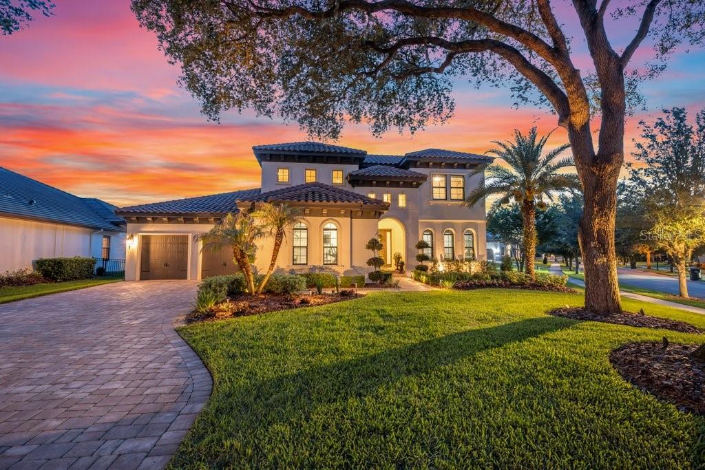 A Remarkable Residence nestled within the prestigious gated community of The Preserve at FishHawk Ranch, this exceptional home sits on an oversized corner lot nearly a 1/2 Acre and offers luxury living at its finest. Stunning Mediterranean-inspired curb appeal welcomes you with lush landscaping, an extended paver driveway, a tile roof, and a spacious three-car garage. Inside, the open-concept floor plan immediately draws your eye through triple sliding glass doors to the sparkling pool and outdoor oasis beyond. A private home office with custom built-ins sits behind French doors off the grand foyer, while an elegant formal dining room connects to the beautifully remodeled gourmet kitchen through a convenient butler’s pantry. The kitchen is a true showpiece, featuring stainless steel appliances, including a built-in oven and microwave, an oversized center island with breakfast bar seating, soft-close white cabinetry with crown molding, tile backsplash, and a walk-in pantry. The spacious great room is highlighted by soaring transom windows, triple sliders, and a dramatic floor-to-ceiling stone gas fireplace. The luxurious owner’s retreat offers coffered ceilings, abundant natural light, private lanai access, dual custom walk-in closets, and a spa-like bath with separate vanities, a freestanding soaking tub, and a walk-in shower. Two additional first-floor bedrooms each feature walk-in closets and private baths, complemented by a convenient media/homework station. Upstairs, a large bonus room/loft and a fourth bedroom with its own bath and walk-in closet create the perfect guest or teen suite. Outdoor living reaches another level with an expansive paver lanai with a built in fire pit surrounding a resort-style pool and infinity-edge spa complete with fountains and a sun shelf. Entertain effortlessly in the fully equipped outdoor kitchen featuring a grill, kegerator, ice machine, beverage refrigerator, and Big Green Egg. Beyond the screened enclosure, a spacious, tree-lined backyard provides room to relax, play, and enjoy the Florida lifestyle. Meticulously maintained and truly move-in ready, this unforgettable residence includes access to FishHawk Ranch’s world-class amenities, including resort-style pools, fitness centers, tennis and pickleball courts, parks, scenic trails, and top-rated schools. Experience the luxury, comfort, and lifestyle this extraordinary home has to offer—schedule your private showing today.
