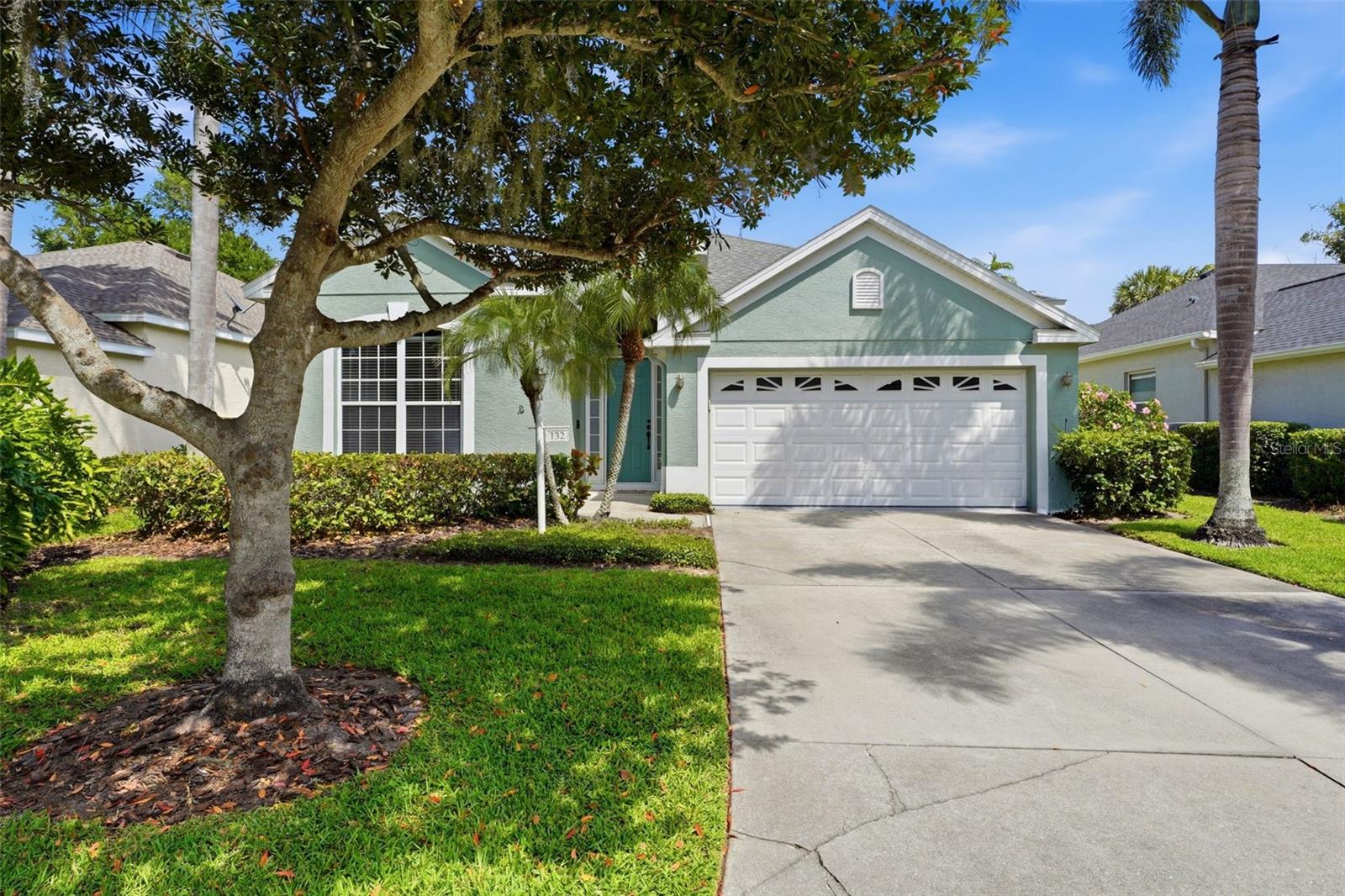 Located in Oak Court, a gated community of approximately 60+ homes just off Fruitville Road, this updated, west-facing, single-story residence offers convenient access to downtown Sarasota, University Town Center (UTC), Gulf beaches, golf courses, parks, and I-75. Set on a private dead-end street with mature canopy trees and landscaped surroundings.
Extensive upgrades include roof (2021), AC (2025), and water heater (2026). Interior features professionally curated paint selections and 24-inch tile flooring (2025) in select areas including two bedrooms and foyer.
The layout offers a flexible front room off the entry, ideal for dining, sitting, or office use. The home then opens into the main living area with vaulted ceilings and an open connection to the kitchen. A separate dining area is positioned just off the kitchen, creating a natural flow for everyday living and entertaining. The living space provides direct access to the screened lanai and hot tub, which conveys with the sale.
Kitchen features a Samsung appliance suite (2025), soft-close cabinetry, pull-out drawers, island workspace, and adjacent dining area. Bathrooms updated with Calcutta wall tile and energy-efficient commodes (2025). Primary suite includes dual sinks, walk-in shower, and walk-in closet. Secondary bedrooms offer built-in storage and custom paint finishes.
Smart home features include Eufy video doorbell and upgraded digital AC thermostat. Additional interior improvements include plantation shutters, vertical blinds, updated lighting fixtures, and ceiling fans.
Garage includes epoxy-coated floor (Galaxy Blue, 2025), custom overhead storage, and fresh interior paint. Exterior upgrades include backyard privacy landscaping with Areca palms (2025) and redesigned irrigation system.
Community amenities include pool, cabana, lake with fountain, and irrigation.