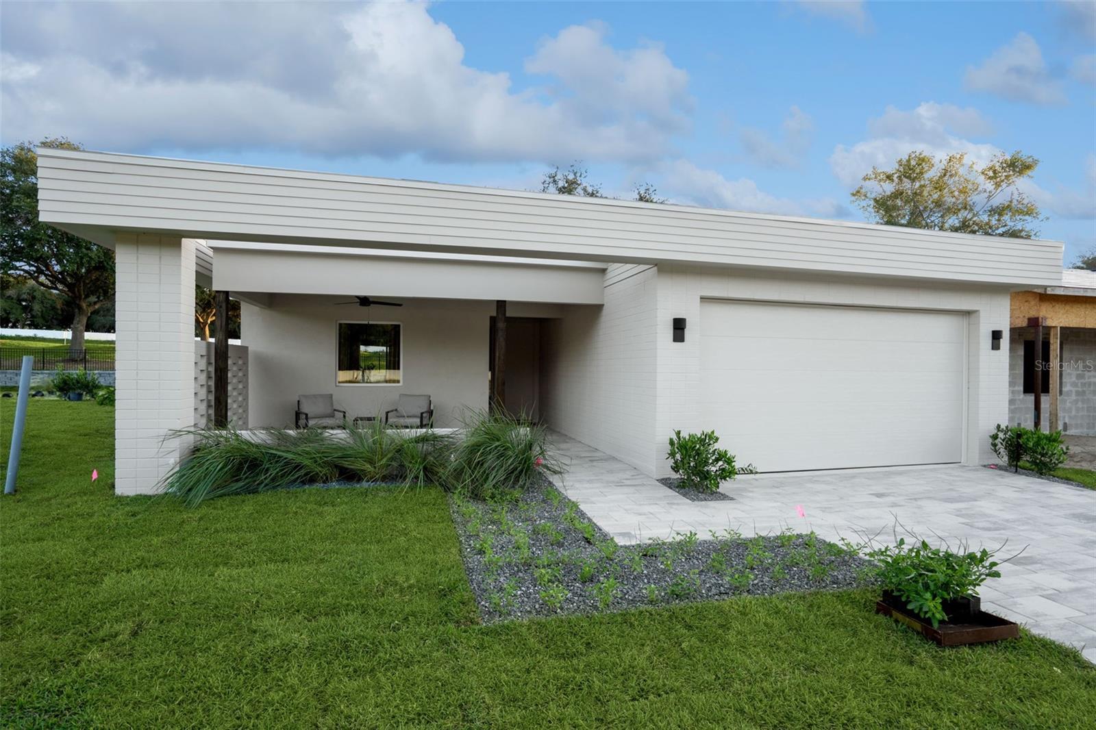 The Magnolia by Moxie Homes is the kind of home that quietly impresses—thoughtfully laid out, light-filled, and easy to love. From its clean, modern elevation to its seamless interior flow, this single-story design was made to elevate everyday living without overcomplicating it. Inside, you'll find three well-proportioned bedrooms and two bathrooms, including a spacious primary suite tucked away for privacy. The open-concept kitchen, dining, and living areas are designed with connection in mind, creating one expansive, welcoming space that adapts to whatever the day brings. For those looking to build their perfect home, the Tupelo offers exciting opportunities for personalization. You'll have the chance to choose your elevation, influencing the roof and/or porch style and courtyard appearance. And to truly give it some Moxie, you can also select an interior upgrade package, going above and beyond the already high standards this builder provides. This allows you to truly customize your home's finishes and features, creating a living space that perfectly reflects your style. This is more than just another new home development in Central Florida; it's where better design meets better living. Enter through our oak tree-lined boulevard and discover Boulevard Oaks, a community designed for connection and activity. You'll find a welcoming clubhouse, The Oasis, for gathering, expansive green space with sports courts, and walking trails to keep you active. Our elegantly appointed clubhouse serves as a central gathering point with inviting lounge areas perfect for casual conversations, reading, or simply unwinding. Dive into relaxation at our resort-style swimming pool, offering a refreshing escape on warm Florida days. Our landscaped greenspace invites you to embrace an active outdoor lifestyle. Meander along picturesque walking paths, perfect for a stroll, a brisk jog, or walking your furry friends. Challenge friends and family to a match on our pickleball courts, a fun and engaging sport for all ages. For a more relaxed pace, our serene park areas provide ideal spots for picnics, outdoor games, or simply enjoying the fresh air and lush surroundings. Listing photos are of the models. Price listed is base price. Upgrades will be additional.
