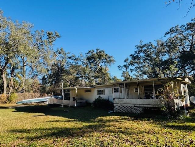 Seller Motivated! Price Improvement in place! Enjoy country living with the convenience of town nearby! This fixer-upper sits on an extra-large lot that is over 1/2 acre of cleared land with beautiful mature trees. The property includes a singlewide mobile home with a front and rear porch. This home is a fixer upper. Equipped with a private well and septic, this property is ideally located near the Withlacoochee State Forest, perfect for nature lovers and outdoor enthusiasts. Convenient access to Hwy 50/Cortez Blvd, Hwy 301, I-75, and the Florida Turnpike makes commuting easy. You’re just minutes from shopping, dining, community events, and the popular Webster Flea Market, and centrally located between Tampa and Orlando. Plus, enjoy being within 45 minutes to an hour of Florida’s beautiful beaches and natural springs. A great opportunity for those seeking space, location, and potential! This property is currently tenant occupied.  The possibilities for this property are endless. This Owner has additional properties that are available and will consider selling all together for one price. All properties are income rental properties.