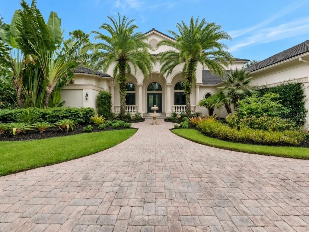 One or more photo(s) has been virtually staged. Announcing a NEW ROOF and FRESH, UPDATED MODERN PAINT COLORS coming soon to 8305 Farington Court, a prestigious estate in The Concession—Bradenton, FL’s premier luxury community! View the virtually staged photos to witness this spectacular transformation. Experience the pinnacle of opulent living—an incredible residence by John Cannon Homes on one of the rare, elongated lots in The Concession that offers stunning water views & picturesque preserve vistas. Your journey begins w/ the striking fountain entry & Cantara iron doors. We welcome you into a beautifully crafted interior. This space showcases high-end finishes, including intricate ceilings, crown moldings, designer lighting, French doors, hardwood floors, custom tiles, marble, & stone. This home is a true embodiment of elegance, w/ furniture-quality cabinetry, two distinct fireplaces, handcrafted built-ins & woodworking, ornate architectural details, Sonos Sound System, superb Windsor Pinnacle windows, & doors that artfully elevate its aesthetic appeal. It boasts impressive sq. ft. & sophisticated formal dining & living spaces w/ ceiling-to-floor windows that overlook the pool & a lake view beyond. This residence has four bedrooms & five baths, along w/ an executive office & a spacious family room combined w/ a breakfast nook. A welcoming bonus media room on the 2nd fl., complete w/ a wet bar & an enclosed balcony, creating the perfect space for relaxation & entertainment. A gourmet kitchen is a true haven for culinary enthusiasts. It features premium appliances: a professional-grade Wolf oven & gas range, a Sub-Zero refrigerator w/ a glass door, & a high-performance Bosch dishwasher. Between the kitchen & formal dining room, you'll find a Butler's Pantry, fully equipped for entertaining. The impressive Owner's Retreat has access to outdoor spaces, enhancing the connection with nature. This suite also has two handsomely designed walk-in closets & a luxurious primary bath. At its center, an exquisite garden tub stands out, complemented by a stunning three-piece shower that includes a rainfall showerhead & an aquarium glass panel overlooking the atrium. Imagine lounging by the gas-heated pool or unwinding in the spa outdoors, all while enjoying breathtaking views of a sprawling lake. An outdoor kitchen area is nothing short of spectacular, perfect for entertaining. Inside, comfort is equally well-appointed, w/ zoned A/C across three units, one replaced in 2018 & another in 2021. The home is equipped w/ natural gas. Nestled within a secure, gated community, The Concession spans over 1,200 acres. It features a privileged number of private homesites that highlight the charm of historic Florida, creating a perfect blend of tranquility & safety. The Concession Golf Club is a premier destination with courses designed by Jack Nicklaus w/ Tony Jacklin, including an 18-hole championship course, a 9-hole par-three course, & a lighted putting course. The club also boasts impressive practice facilities, featuring a driving range, as well as large putting & chipping greens. Additional amenities comprise a pro shop, guest lodging, The Bistro, a diverse dining experience offering 365 wines, monthly social events, & a Sat. morning market. There are both Social & Golf Membership options. For availability, contact the Membership Director. Enjoy vibrant shops, restaurants, and entertainment nearby, plus Sarasota's beaches and attractions—without CDD fees!