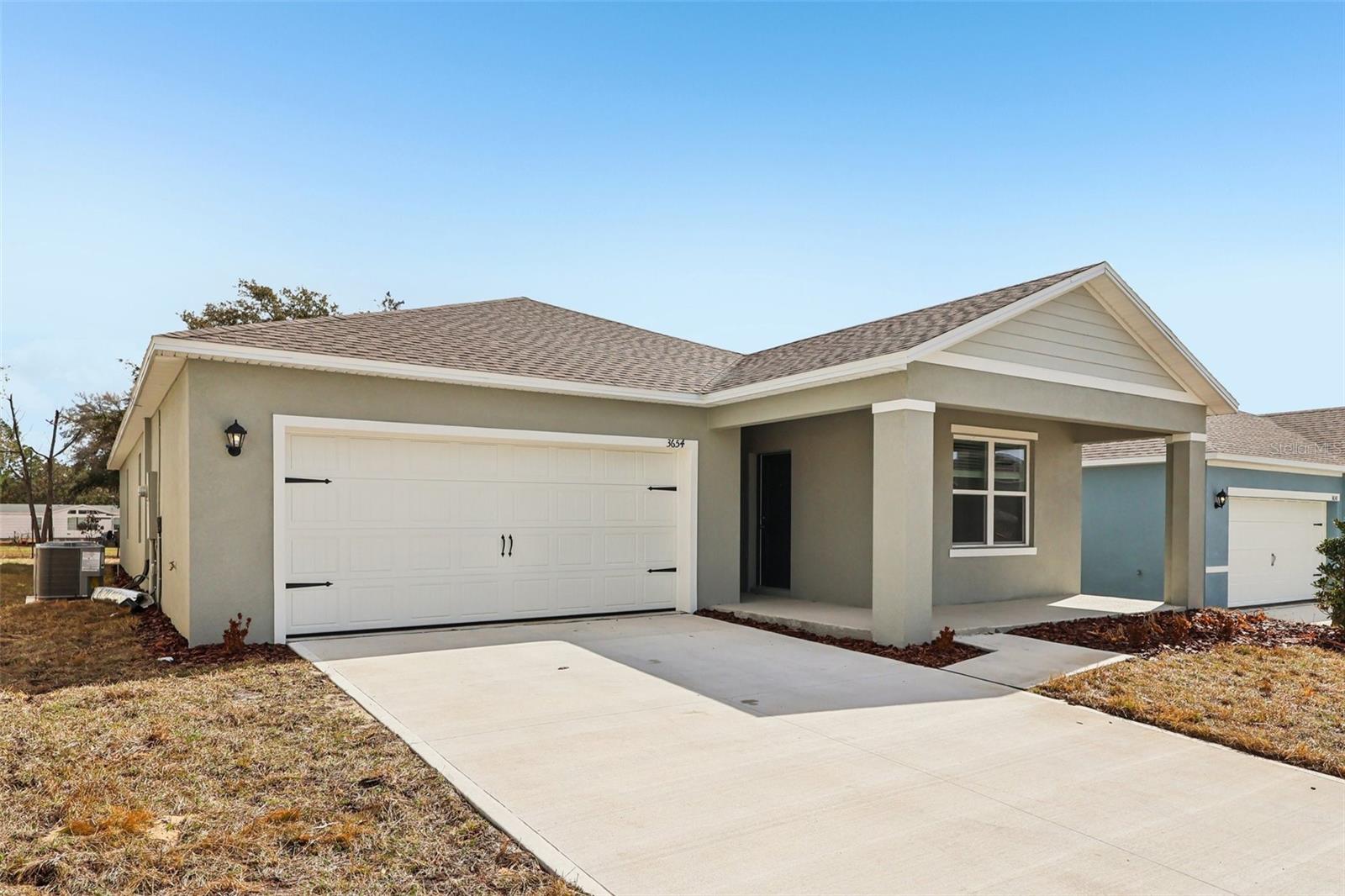 Under Construction. Welcome to the Lakeside Multi-gen, one of our one-story floorplans featured in our Hamilton Bluff community in Haines City, Florida. Take your pick between two artfully designed exteriors.

Inside this beautiful 4 bedroom, 3-bathroom home, you'll find 2,077 square feet of comfortable living. The living area is an open concept, where your kitchen, living, and dining areas blend seamlessly into a space perfect for everyday living and entertaining. The kitchen features modern cabinets, quartz countertops, and sleek stainless-steel appliances, which are sure to both turn heads and make meal prep easy. You'll never be too far from the action with the living and dining area right there.

Find special Revwood flooring throughout a majority of the home including the family room, kitchen, bathrooms, laundry and foyer. Bedrooms 2,3, and 4 will have carpeted floors and a closet in each room. Whether these rooms become bedrooms, office spaces, or other bonus rooms, there is sure to be comfort. This home also includes a private in-law suite featuring a sitting area and kitchenette. 

The primary bedroom has its own attached bathroom that features a walk-in closet and all the space you need to get ready in the morning. Privacy is guaranteed with a separate door for the toilet and shower.

Contact us today and find your home at Hamilton Bluff.

*Photos are of similar model but not that of the exact house. Pictures, photographs, colors, features, and sizes are for illustration purposes only and will vary from the homes as built. Home and community information including pricing, included features, terms, availability, and amenities are subject to change and prior sale at any time without notice or obligation. Please note that no representations or warranties are made regarding school districts or school assignments; you should conduct your own investigation regarding current and future schools and school boundaries.*