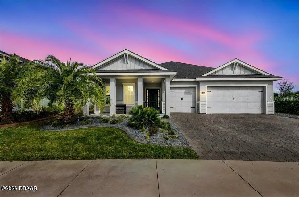 Better Than New & Now One of Port Orange’s Best Values.

Built in 2023 and loaded with upgrades, this stunning 4-bedroom, 3-bath home shows like a model and delivers the features buyers are looking for without the wait or added expense of new construction.

From the moment you arrive, you’ll notice what sets this home apart — a true full 3-car paver driveway, professionally cleaned and sealed in 2024, offering exceptional curb appeal and added parking. Inside, the home is bright, modern, and thoughtfully finished with quartz countertops, GE appliances, soft-close cabinetry, plantation shutters, custom remote-controlled blinds, and ceiling fans throughout. Energy-efficient lighting enhances every space while keeping costs down.

The open living area is both stylish and functional, complete with a professionally installed TV and hidden wiring for a clean, polished look.

Step outside and enjoy Florida living at its best on the extended screened-in paver patio (2024) spanning the entire back of the home — the perfect space to relax or entertain, complete with a mounted outdoor TV.

Additional upgrades include: Professional concrete curbing and rock landscaping (2025)
Upgraded irrigation system on well water (2025) for added savings. Permanent Trimlight exterior lighting (2024) — fully customizable for year-round elegance and special occasions.

Located in a desirable Port Orange community, this home also offers access to a nearby community pool — enjoy the lifestyle without the cost or maintenance of a private pool.

Now competitively priced and move-in ready, this is a standout opportunity in today’s market. With an acceptable offer, the seller is offering up to $5000. toward buyer closing costs or interest rate buy-down. Seller is motivated and looking for a smooth, timely transaction.

Schedule your showing today — homes like this don’t come around often.