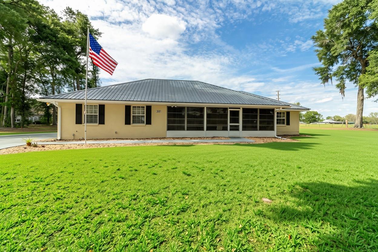 MULTI-GENERATIONAL LIVING OR RENTAL UNIT With Separate, Private Spaces — Minutes From Florida’s Best Springs.  This Fort White property is a rare find for anyone seeking true multi-generational living without sacrificing comfort, privacy, or location. Set just minutes from world-famous Ginnie, Blue, and Poe Springs—and close to the Santa Fe River, Ichetucknee (5 miles), and Suwannee River (15 miles)—it offers an unbeatable lifestyle for those who love swimming, diving, tubing, canoeing, or kayaking. Gainesville and Lake City are each an easy 25-minute drive, with the added benefit of lower Columbia County taxes and utilities.  What truly sets this home apart is its purpose-built multi-generational layout. The main residence features 2 bedrooms and 2 bathrooms, while the attached apartment lives like its own home, complete with 1 bedroom, 1.5 baths, a full kitchen, dining area, and living room. Whether you’re accommodating parents, adult children, long-term guests, or exploring rental potential, the setup provides comfort and independence for everyone.  Located in the quiet, no-HOA community of Hollingsworth Estates—just two streets and 24 homes—the property sits on a peaceful cul-de-sac overlooking open pasture land. Recent updates include a metal roof (2015) and HVAC (2020). Outdoor living is easy with a screened front porch and a fully enclosed back porch, perfect for enjoying the surrounding nature.  A standout opportunity for families seeking flexibility, privacy, and the freedom of true multi-generational living—all with exceptional access to Florida’s natural springs and rivers.