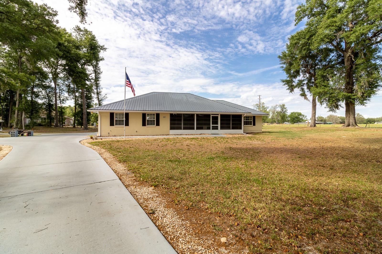 Multi-Generational Home Minutes from Florida’s Best Springs.  Enjoy the perfect blend of privacy, flexibility, and outdoor adventure in this well-maintained Fort White home. Located just minutes from world-famous Ginnie, Blue, and Poe Springs—and close to the Santa Fe River, Ichetucknee (5 miles), and Suwannee River (15 miles)—this property is ideal for anyone who loves swimming, diving, tubing, canoeing, or kayaking. Gainesville and Lake City are each an easy 25-minute drive, and you’ll appreciate the benefit of lower Columbia County taxes and utilities.  Designed for multi-generational living, the property includes a 2-bedroom, 2-bath main home plus an attached 1-bedroom apartment with 1.5 baths, a full kitchen, dining area, and living room. Perfect for extended family, guests, or rental potential.  Located in the quiet, no-HOA subdivision of Hollingsworth Estates—just two streets and 24 homes—the property sits on a cul-de-sac for added privacy and overlooks peaceful pasture land. Recent updates include a metal roof (2015) and HVAC (2020). Outdoor living is easy with both a screened front porch and a fully enclosed back porch.  A rare opportunity to enjoy quiet country living with unbeatable access to Florida’s natural springs and rivers.