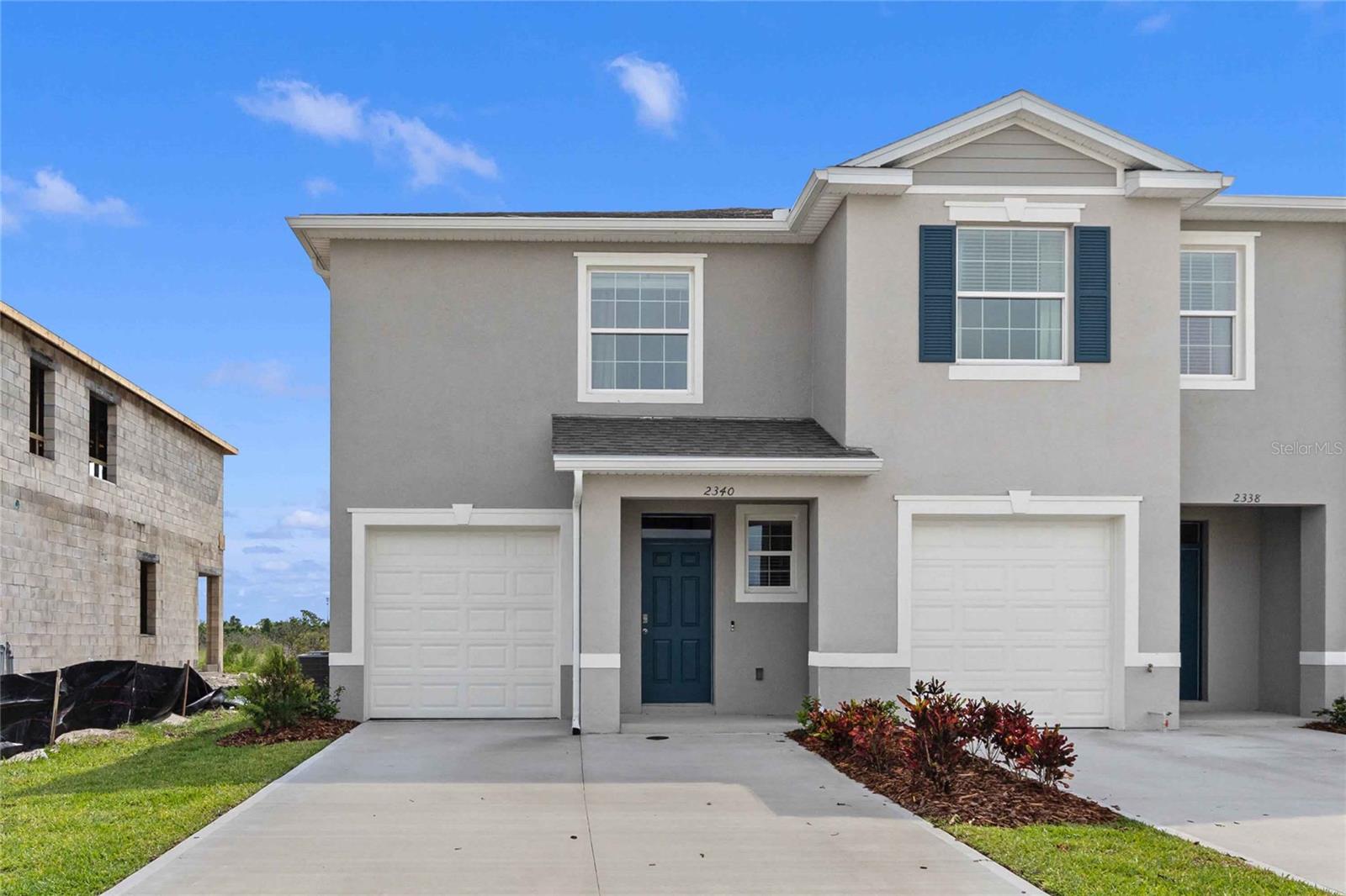 This two story, all concrete block construction end unit townhome has an open concept downstairs that includes a spacious kitchen, powder room, and a spacious family room overlooking the covered rear lanai providing great space for entertaining family and friends. The home includes sleek stainless-steel appliances. As you head up to the second-Floor plan, you are greeted with bedroom one that features an ensuite bathroom, two additional bedrooms, a full bathroom, and a laundry area. Like all homes in Thompson Grove, the Glen includes a Home is Connected smart home technology package which allows you to control your home with your smart device while near or away. Your new townhome will always have fantastic curb appeal while allowing you time to do the activities your family enjoys most.  *Photos are of similar model but not that of exact house. Pictures, photographs, colors, features, and sizes are for illustration purposes only and will vary from the homes as built. Home and community information including pricing, included features, terms, availability and amenities are subject to change and prior sale at any time without notice or obligation. Please note that no representations or warranties are made regarding school districts or school assignments; you should conduct your own investigation regarding current and future schools and school boundaries.*
