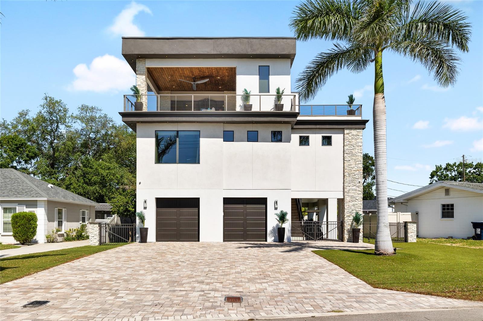Under contract-accepting backup offers. Welcome to your private sanctuary on exclusive Davis Islands—this 3,000 sq ft luxury residence offers a rare blend of elegance, comfort, and breathtaking panoramic views of the bay, the island's private airport, and the skyline of downtown Tampa. Thoughtfully designed with soaring ceilings and expansive windows, this home is filled with natural light and a seamless indoor-outdoor flow. Multiple balconies throughout the home showcase captivating water and runway views, making it the perfect setting to relax, entertain, or simply watch the world take off. Inside, you’ll find high-end finishes at every turn—from custom cabinetry and designer lighting to premium flooring and top-of-the-line appliances. The open-concept living area and gourmet kitchen are a true centerpiece, offering style and functionality for both everyday living and elevated entertaining. Step outside to your private pool oasis, surrounded by zero-maintenance landscaping and multiple lounging areas, perfect for enjoying Florida’s year-round sunshine. With elegant, modern architecture and thoughtfully curated design details, this home offers the ultimate Davis Islands lifestyle—quiet, exclusive, and effortlessly luxurious. A few key features of this home: 5-year-old Durolast roof, HVAC 1 is 1.5 years old, HVAC 2 is 3 months old, electric tankless water heater, 8+ car driveway, 4-car garage, 8-person capacity elevator, CCTV security system, new exterior paint, and much more! A rare opportunity to own a truly special home in one of Tampa’s most prestigious neighborhoods. Schedule your private showing today.