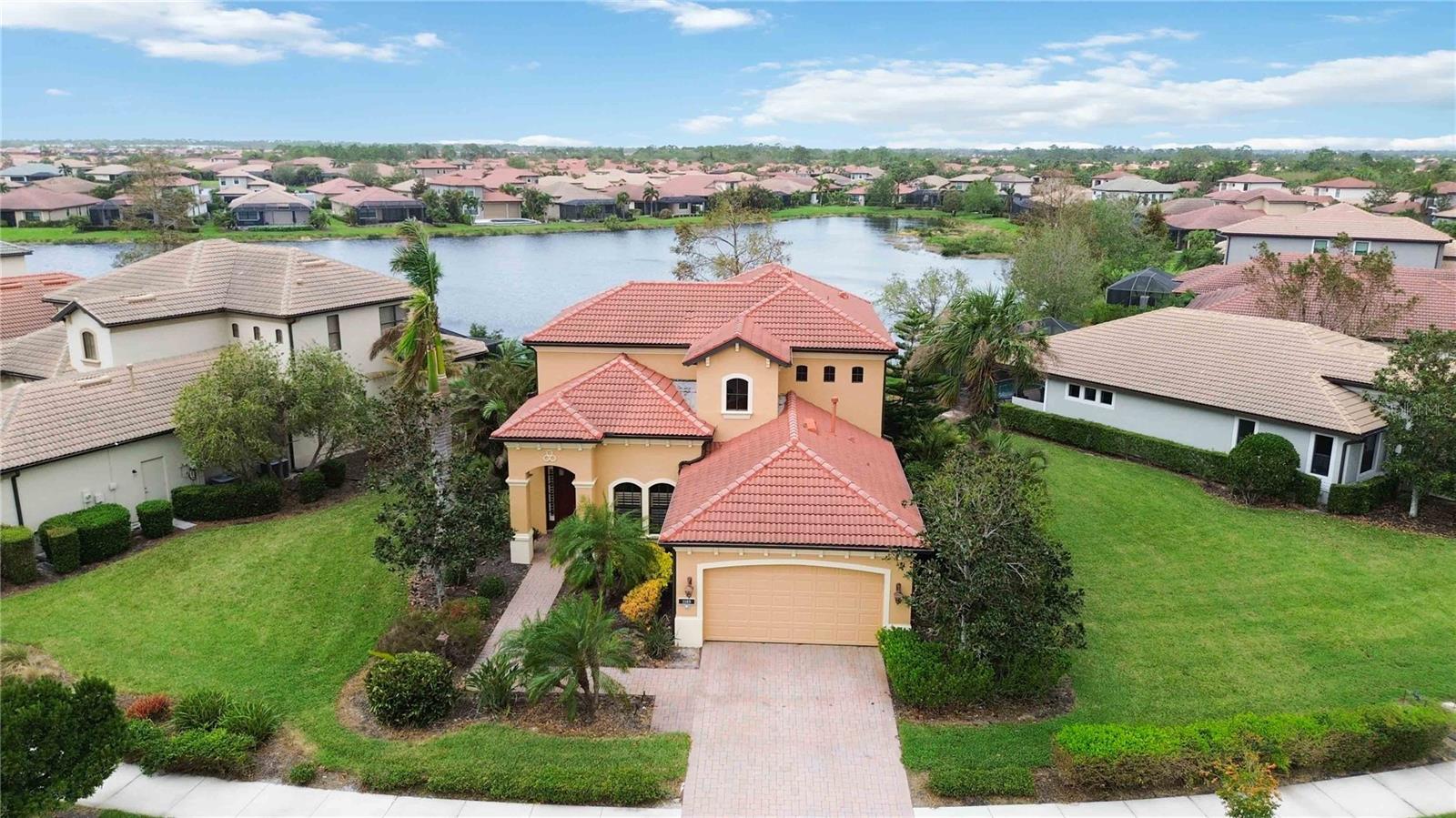 Welcome to an exceptional residence in Willow Chase, where style, comfort, and convenience come together beautifully. This property, offered partially furnished, provides a seamless blend of spacious living and resort-style amenities, perfect for a variety of lifestyles. With 3 bedrooms, 2.5 baths, and a versatile loft, this home is designed to meet all your needs.
As you step inside, you’re welcomed by 22.5' soaring ceilings in the main living area that fill the space with natural light, creating an open, inviting atmosphere. The primary suite on the main floor offers two walk-in closets and a large bathroom with a soaking tub, walk-in shower, and private water closet—your own private retreat. The first floor also includes a conveniently located half bath.
The flexible layout includes a dining room currently used as an office and breathtaking lake views from several rooms. The kitchen adds sophistication with lighted cabinets, ideal for both everyday dining and entertaining. Upstairs, a spacious loft offers a second living area, hobby space, or guest lounge, with two additional bedrooms and a full bathroom.
Outdoors, you'll enjoy a resort-inspired retreat with a northwest-facing lanai perfect for sunset views. The outdoor kitchen, complete with a wine refrigerator, makes hosting a breeze, and the spa with spillover into the pool, along with an outdoor shower, brings the essence of Florida living to your backyard.
Willow Chase is a maintenance-free community that enhances your lifestyle with amenities such as a resort-style pool, fitness center, playground, and courts for tennis and pickleball. Conveniently located just 2 miles from Sarasota Memorial Hospital - Venice, with quick access to I-75, this home is also close to Nokomis Beach (6 miles) and the vibrant downtown Venice area with its array of dining, shopping, and cultural attractions.
Whether you’re seeking a spacious home, a seasonal escape, or a peaceful retreat, this Willow Chase property offers an exceptional lifestyle. Schedule a tour today to experience it for yourself!