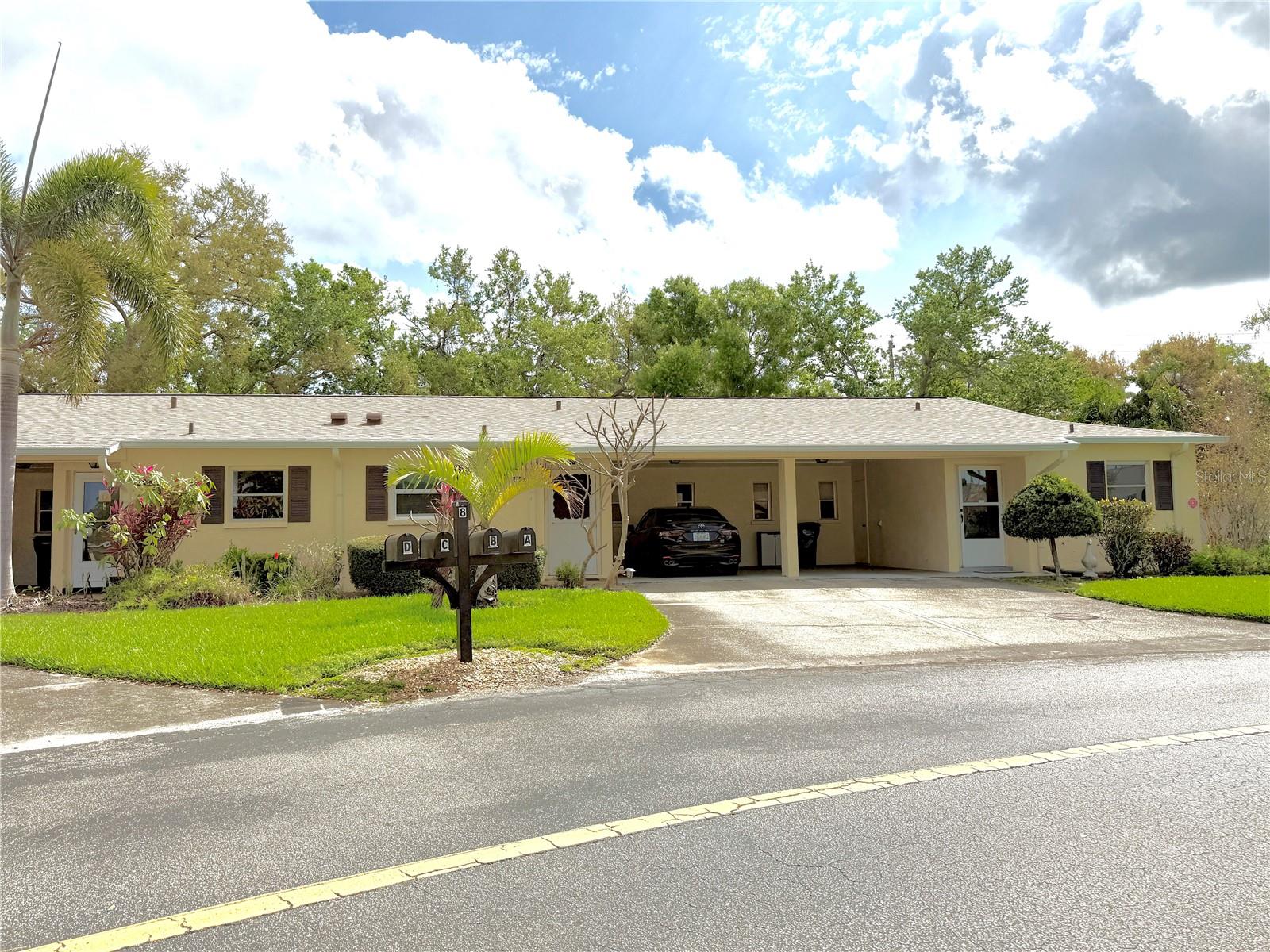 Exceptionally well kept end unit villa in beautiful Desoto Square Villas. Located very near the clubhouse, heated pool, shuffleboard, tennis, and pickleball courts. Being offered beautifully turnkey furnished. Lovely window treatments and newer modern flooring. AC and Hot water heater are both newer and this villa also features a really nice private stack washer/dryer in laundry room off the carport. Rear patio and backyard is fenced for privacy. Gated community 24/7 located near shopping and restaurants and a quick drive to the beautiful beaches of Anna Maria Island. Just down the street from the Pittsburgh Pirates spring training facility! Seller has already paid off the special assessment. Very nice newer roof. Professionally managed and a really fun place to live year round or use as a seasonal residence.