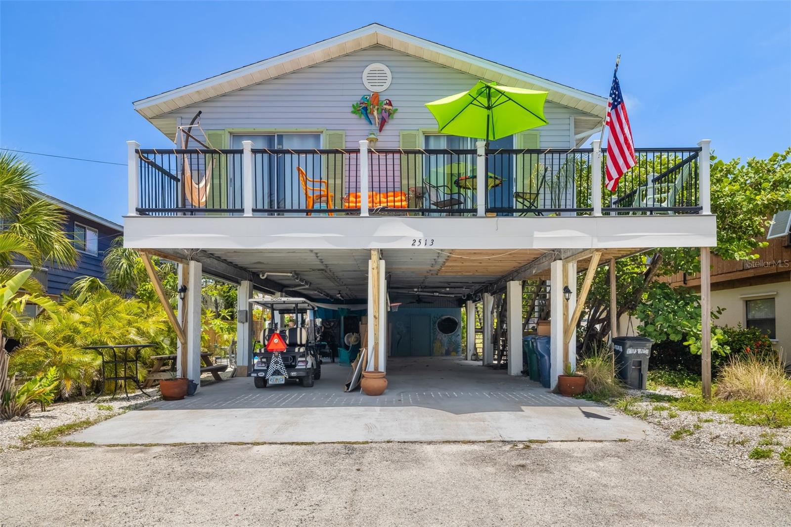 Virtually Staged. Perfectly positioned between the Gulf of Mexico and Sarasota Bay, this elevated coastal home offers the best of island living just steps from the water in both directions. Whether it’s morning walks along the bay or sunset evenings on the beach, this location delivers the Florida lifestyle buyers are searching for.

Inside, the home features a bright, open layout with updated flooring throughout and a fully renovated kitchen complete with shaker-style cabinetry, granite countertops, stainless steel appliances, and a modern tile backsplash. The open living and dining space flows seamlessly to a private upper-level deck—ideal for relaxing, entertaining, or enjoying the coastal breeze.

The primary bedroom also offers direct access to the deck, creating a true indoor-outdoor living experience. Both bathrooms have been tastefully updated with modern finishes, including a walk-in shower and upgraded vanities.

The elevated design provides covered parking and additional storage space below, offering both convenience and functionality. Recent updates and well-maintained systems, including the roof, add to the overall value and peace of mind.

Located in the heart of Bradenton Beach, this property places you just moments from the white sand beaches of Anna Maria Island, local dining, shops, and nearby parks with tennis courts and bayfront views. Whether you’re searching for a primary residence, vacation getaway, or investment opportunity, this home offers flexibility and an unbeatable coastal location.