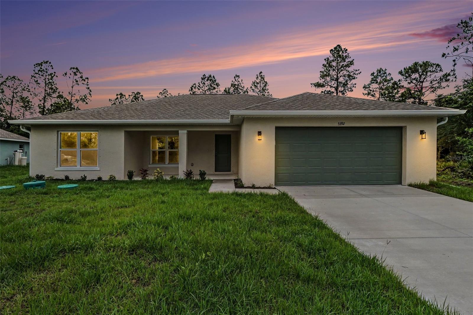 Brand new construction with modern finishes plus an open layout designed for easy Florida living. Luxury vinyl tile flooring, crown molding, soaring ceilings, plus abundant natural light create a bright, welcoming atmosphere throughout. The kitchen features quartz countertops, ceiling-height cabinetry, a full-height backsplash, peninsula seating, plus a premium Samsung SS appliance package. The spacious primary suite offers a tray ceiling, WIC, dual-sink quartz vanity, + a frameless glass walk-in shower wrapped in striking tile. Three additional bedrooms provide flexibility for guests, family, or a home office, while the guest bath showcases a quartz vanity plus a tiled tub/shower combination. Sliding glass doors open to a covered lanai overlooking the backyard, creating the perfect setting for outdoor relaxation. A dedicated laundry room, 2-car garage, + thoughtful storage complete the home. Conveniently located in growing North Port near shopping, dining, golf, + Gulf Coast beaches.