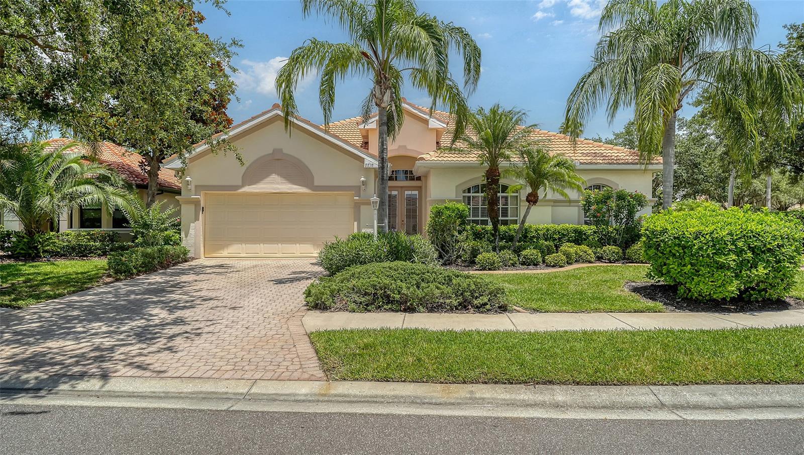Welcome Home to this meticulously maintained and maintenance free 4bed/3 bath + den with pool behind the gates of Lakewood Ranch Country Club! You will love the light and bright open floor plan with wood plank tile floors and 2512 SF of living space. The impressive chef's kitchen features 42" cabinets and granite counters with stainless appliances open to the family room making it the perfect space for cooking and entertaining. There is a formal dining area and living room with sliders to the pool plus a den/bonus room with french doors that can serve many purposes. Retire to your primary suite with a generous walk in closet and bath with dual sinks. The split floor plan is the perfect layout with 3 additional bedrooms and laundry providing privacy for guests or family members. Relax and unwind by the pool and patio with plentiful deck space and covered area for lounging or for an outdoor kitchen. The oversized end lot with additional yard space and natural landscaping is the ultimate in privacy and seclusion.  Numerous upgrades to this home include newer roof 2019, newer AC 2023, new pool pump and filter, updated washer/dryer and pebbletec pool surface ! Lakewood Ranch Country Club offers an abundance of amenities that make it the premier community for golf with access to 4 championship golf courses and 18 tennis courts, pickleball, fitness center, and an elegant clubhouse with so many social events. There are numerous membership options available. This premier location offers close proximity to UTC premier shopping, dining, cultural attractions, A-rated schools, and beautiful Gulf beaches just minutes away. This is the ultimate Country Club Lifestyle!
