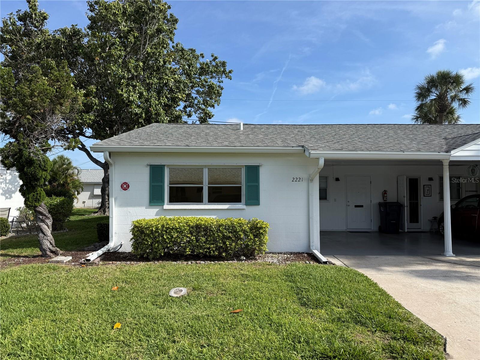 This 2 bedroom, 1 bathroom villa with an enclosed lanai has many updates and is steps to the community pool. Popcorn ceilings and carpet have been removed and it has been freshly painted.  Additional updates are new interior doors, hardware, and light fixtures. A new washer and dryer and a new water heater have been installed. Kitchen and bathroom ceilings have been raised. The kitchen has been opened to the dining and living areas and has new quartz countertops. New Levolor honeycomb blinds are insulating and noise reducing. Each bedroom has its own walk in closet. There is attic storage accessed from the carport. Parkway Villas is a 55+ community with a clubhouse with saunas, and a heated pool. Convenient to many popular destinations: approximately 8 miles to Anna Maria Island, 7 miles to downtown Sarasota, 6 miles to downtown Bradenton, 4 miles to SRQ Airport, 2 miles to IMG Academy, and less than half a mile to shopping, library, and local restaurants.