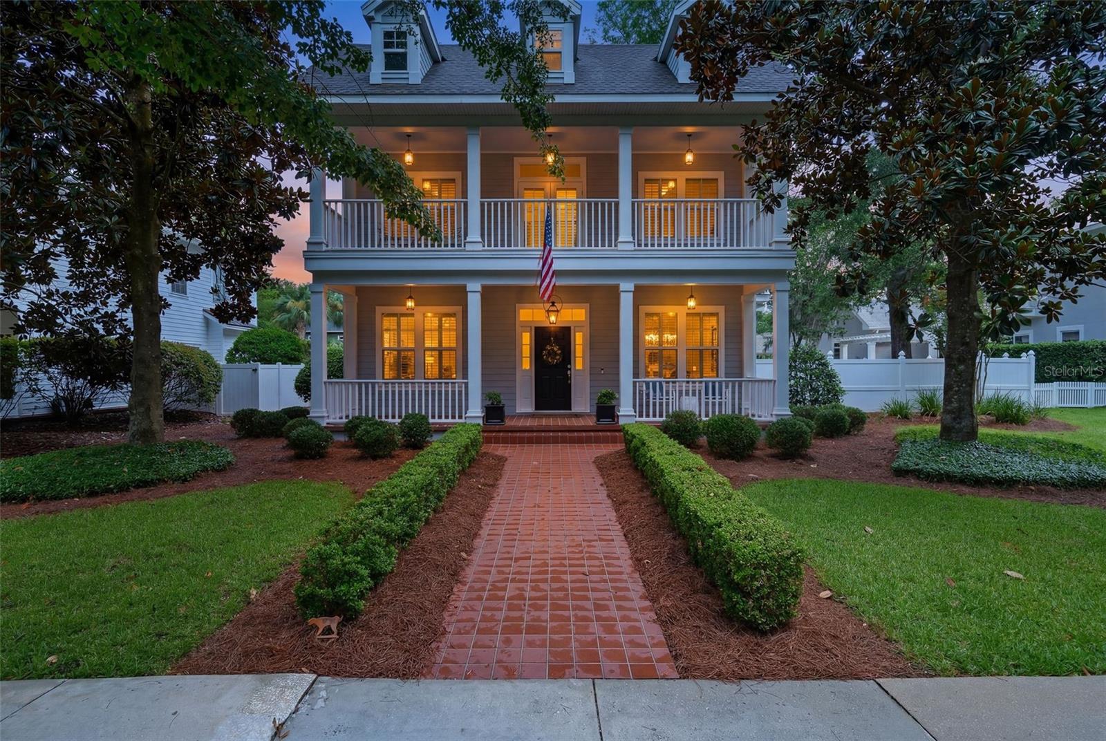 Nestled on a premium lot in the highly sought-after Town of Tioga, this storybook-inspired two-story home offers timeless charm, exceptional space, and an unbeatable lifestyle. Boasting 4 bedrooms, 3 full bathrooms, a spacious study, and a formal dining room, this thoughtfully designed floor plan provides both elegance and everyday functionality.

The main level features a private primary suite tucked away at the rear of the home, along with a guest bedroom and full bath—ideal for visitors or multi-generational living. The spacious primary retreat includes a large walk-in closet and an ensuite bath with a soaking tub, separate glass-enclosed shower, and dual vanities.

At the heart of the home, the beautifully appointed kitchen showcases timeless white cabinetry, stainless steel appliances including a Thor gas dual fuel stove, LG Microwave and Dishwasher and newer Samsung fridge. The open-concept kitchen design flows seamlessly into the inviting great room, where a cozy gas fireplace creates the perfect gathering space.

Upstairs, you'll find two generously sized guest bedrooms, a full bathroom with dual sinks, a versatile flex room perfect for a playroom or reading nook, and French doors leading to a charming second-story balcony.

Relax on your screened patio or step outside to enjoy the fully fenced backyard, complete with a majestic oak tree that provides abundant shade and plenty of room to add a pool if desired. Whether relaxing outdoors or entertaining family and friends, this expansive homesite offers endless possibilities.

Just a short stroll away, residents enjoy Town of Tioga's outstanding amenities, including the community clubhouse, resort-style pool, playground, basketball, tennis, and beach volleyball courts, all connected by the beautifully landscaped Esplanade. The adjacent Tioga Town Center offers the ultimate walkable lifestyle with boutique shopping, popular restaurants, medical offices, and Gainesville Health & Fitness just moments from your front door.

This is more than a home—it's the opportunity to enjoy one of the area's most desirable communities with timeless architecture, exceptional amenities, and everyday convenience.