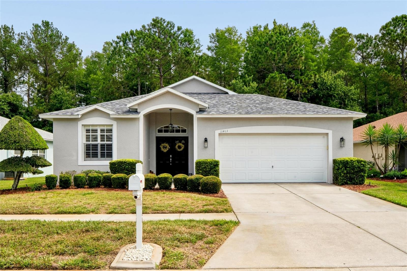 WELCOME TO SUMMERTREE.....THE NATURE FRIENDLY 55+ COMMUNITY.  THIS BEAUTIFUL HOME WILL CHECK ALL YOUR BOXES.  NUMEROUS UPGRADES THROUGHOUT.  DOUBLE DOOR ENTRY WILL LEAD YOU INTO THE LARGE OPEN FOYER.  TO THE LEFT IS ACCESS TO BEDROOMS 2 AND 3 IN ADDITION TO A WELL IMPROVED GUEST BATH. LOOK AHEAD TO YOUR OPEN CONCEPT LIVING AREA CONSISTING OF THE LIVING ROOM, FORMAL DINING, KITCHEN AND BREAKFAST NOOK.  DESIGN IS AN ENTERTAINING DELIGHT!  FEATURES INCLUDE GRANITE COUNTERTOPS, NEWER APPLIANCES, STONE COVERED BREAKFAST BAR WITH ROOM FOR SEATING, DESIGNER LIGHTING, PANTRY, LARGE SCREEN TV ATTACHED TO WALL, WINDOW SHUTTERS, CEILING FAN, CHANDELIERS AND MORE.  BONUS FLORIDA ROOM (NOT INCLUDED IN PUBLIC RECORDS) IS ACCESSED THROUGH THE BREAKFAST NOOK.  PANORAMIC VIEWS FROM WINDOWS WITH REMOTE SHADES, IN ADDITION TO AN HVAC SYSTEM, MAKES THIS A SERENE RETREAT ON A BUSY DAY.  ALSO, OFF LIVING AREA, IS YOUR PRIMARY SUITE WHICH INCLUDES AN ENSUITE BATH AND 2 WALK--IN CLOSETS.  ENJOY PROFESSIONALLY INSTALLED WINDOW SHUTTERS THROUGHOUT THIS LOVELY HOME.  HOA MAINTENANCE INCLUDES LAWN CARE, WELLS FOR IRRIGATION, EXTERIOR PAINTING, INTERNET, CABLE, TRASH COLLECTION AND MORE.  SUMMERTREE RECREATION HAS ENDLESS ACTIVITIES.  ENJOY THE TENNIS COURTS, PICKELBALL, BOCCE, SHUFFLEBOARD, FITNESS CENTER, BILLARDS ROOM, ARTS AND CRAFTS, LIBRARY, COMPUTER ROOM, AUDITORIUM WITH MANY PRESENTATIONS, GARDEN ROOM FOR PRIVATE PARTIES, HEATED SWIMMING POOL WITH SPA AND NUMEROUS OTHER PERKS!  PRIVATE 9 HOLE GOLF COURSE IS AVAILABLE FOR A NOMINAL FEE.  OUR ESTABLISHED NATURE-LOVING COMMUNITY OFFERS LOW HOA DUES, NO CDD, WILDLIFE SIGHTINGS CONVENIENT TO MAJOR COMMUTER ROUTES, SHOPPING, HEALTH CARE, OUTSIDE ENTERTAINMENT, BEACHES, TAMPA, CLEARWATER AND ST. PETE.  TAMPA AIRPORT IS EASILY ACCESSIBLE FROM THE SUNCOAST EXPRESSWAY.  YOU WILL LOVE SUMMERTREE AND 11413 BLOOMINGTON COURT WILL BE YOUR PERFECT NEW HOME.