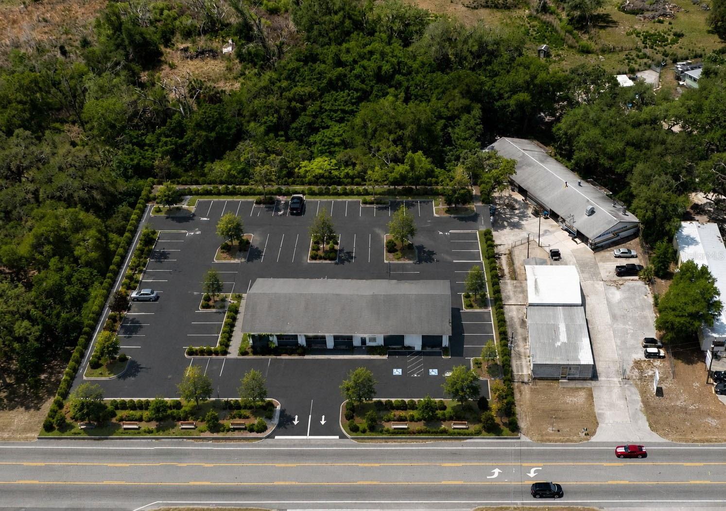 One or more photo(s) has been virtually staged. 2 PARCELS FOR THE PRICE OF 1!.. Yes you read that right, and these 2 parcels make up 3.13 acres directly on Federal Highway US 41, with a sound structure in place... Endless possibilities for this property to be utilized to maximize its potential!.. Additionally, this rare gem of Florida land is centrally located within the county, with multiple other major roadways nearby... 417 feet of road frontage and the property extends deep back off of the road to a lake... Most of the roadway on US 41 (N. Florida Ave) and nearby major roads are in the process of - or already completed - their road expansion... The location of this closed structure and vacant land is in one of the few remaining areas in the county to undergo road widening which will increase value & traffic to the area once complete... Hernando has recently exploded with growth, commercial & residential... An abundance of Florida's natural springs, wildlife preserves and parks are all also nearby and downtown is a minute drive... This structure originally operated as a gas station and over the years has been an auto repair shop, and hosted a towing company... All usable machinery within the structure is negotiable with the sale... In county limits... No Flood Zone!