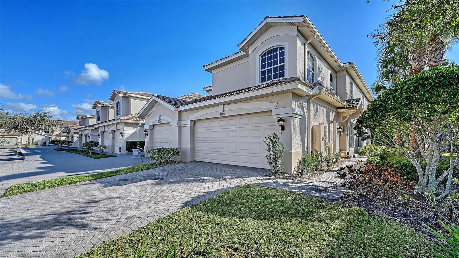 Located in the highly desirable Palmer Ranch area and less than five miles to the world-famous beaches of Siesta Key, this spacious 3BR/2BA second-floor condo offers 2,045 sq ft and the largest floorplan in Arielle with peaceful southern preserve views from the screened lanai, living room, and gathering room. A private two-car garage with extra storage and interior staircase entry (plus convenient side entrance for guests) welcomes you into an open, light-filled layout featuring dual living areas, formal dining space, and a well-designed kitchen with ample cabinetry, counter space, café dining area, and adjoining gathering room. The generous primary suite includes a soaking tub, separate shower, dual vanities, private water closet, and dual walk-in closets, while the second suite offers a charming window bench seat and private access to a full bath; the third bedroom with double doors and closet functions beautifully as a study or flex space. Main living areas feature laminate flooring, bedrooms offer newer plush carpet, and tile accents the baths, entry, kitchen, and café area. Recent updates include AC (2018), washer, dryer, refrigerator, range, dishwasher, microwave, stainless steel kitchen sink, entry light fixture, all faucets and plumbing fixtures throughout, and updated door hardware, knobs, locks, and hinges. Arielle is a gated community with paver driveways and sidewalks, heated pool, gas grills, cable TV, and central mailboxes, with water and basic cable included in the HOA; the community pool is just a short walk away, and residents enjoy easy access to shopping, dining, YMCA, I-75, and the Legacy Trail’s miles of biking and walking paths.  Furnished and ready for immediate occupancy!